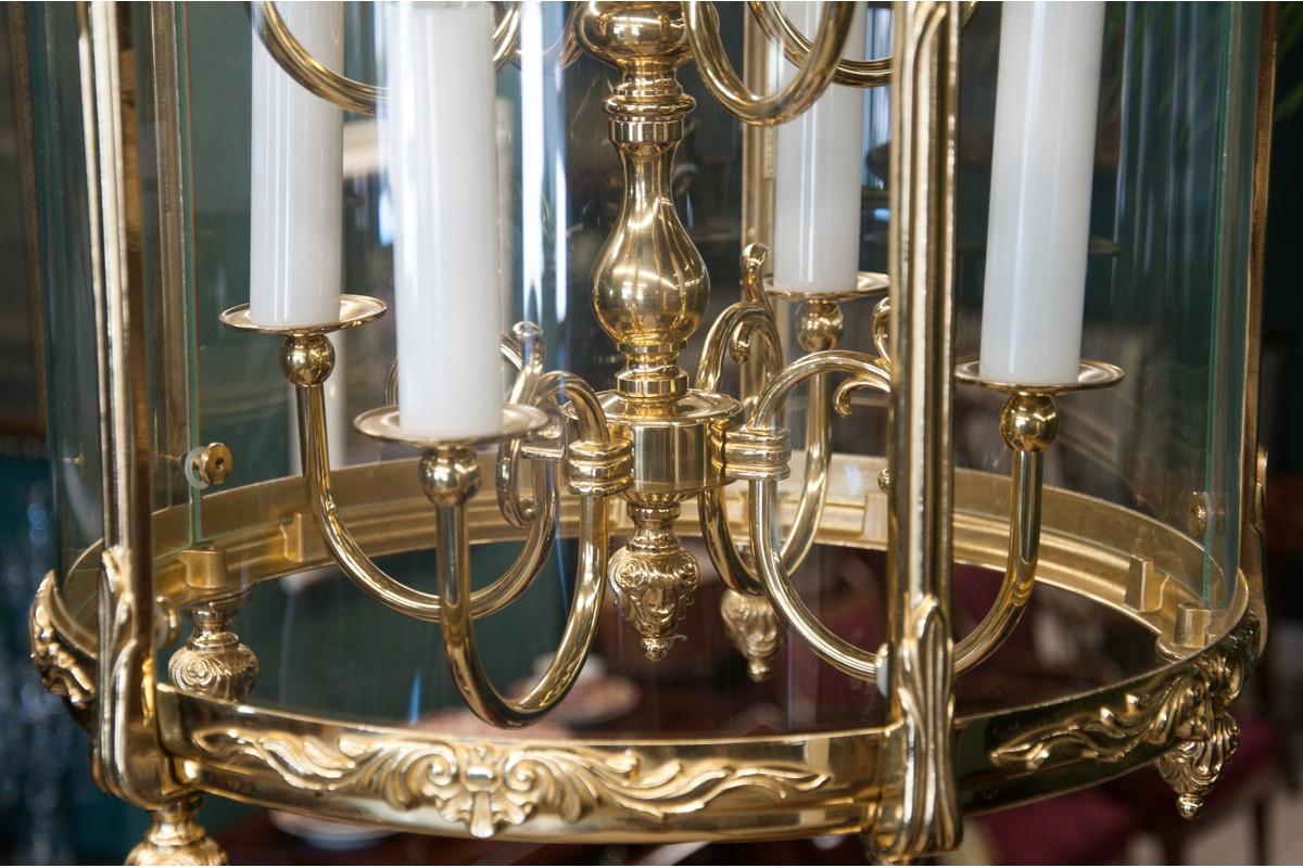 Majestic chandelier in the form of a lantern with 8 bulbs. Made of polished brass and glass.
