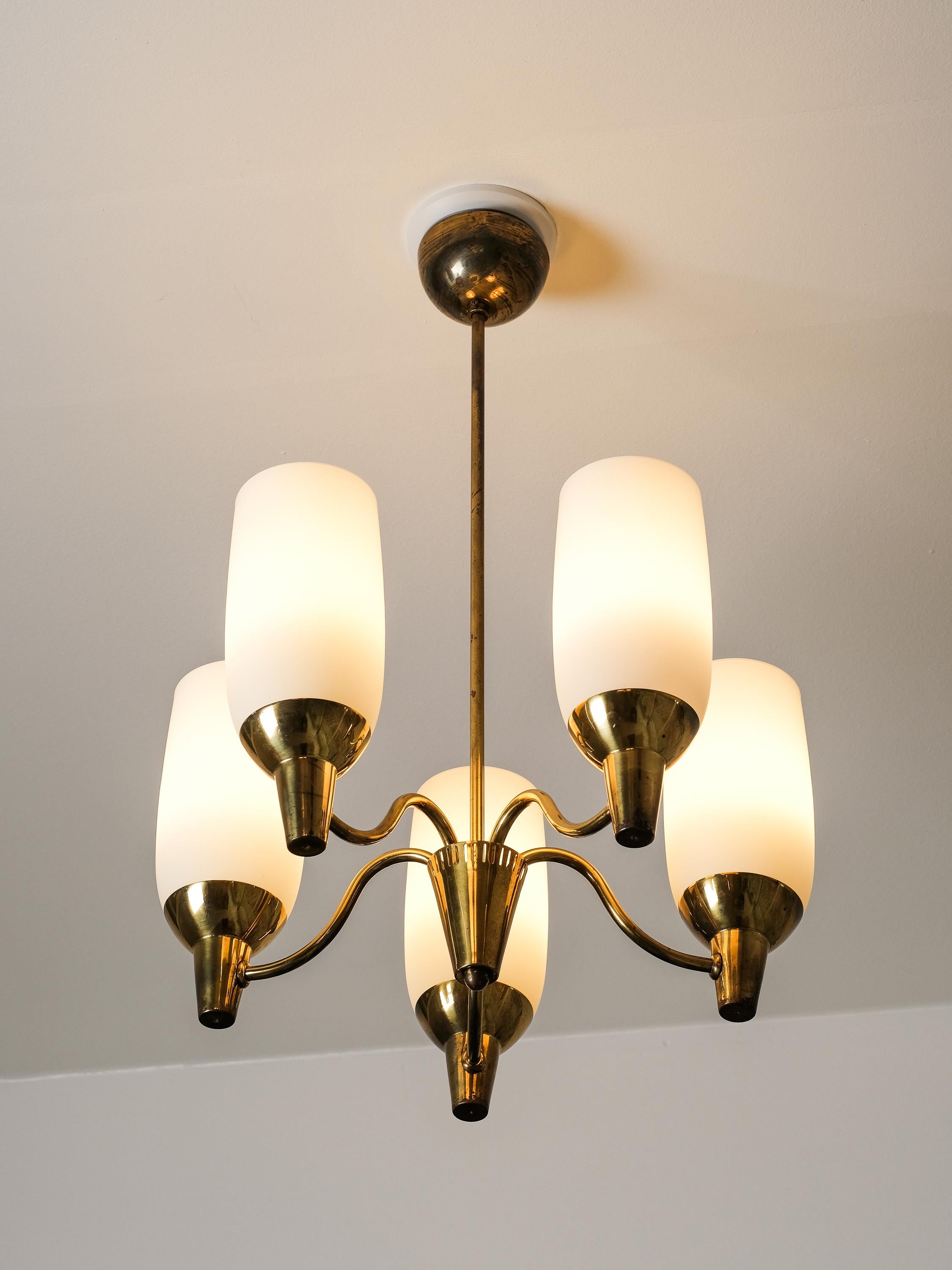 A rare and elegant creation by Finnish designer Mauri Almari, this Model 51168 chandelier was produced by Idman Oy in the 1950s and stands as a quintessential example of Nordic mid-century lighting design. Crafted entirely in brass, the chandelier