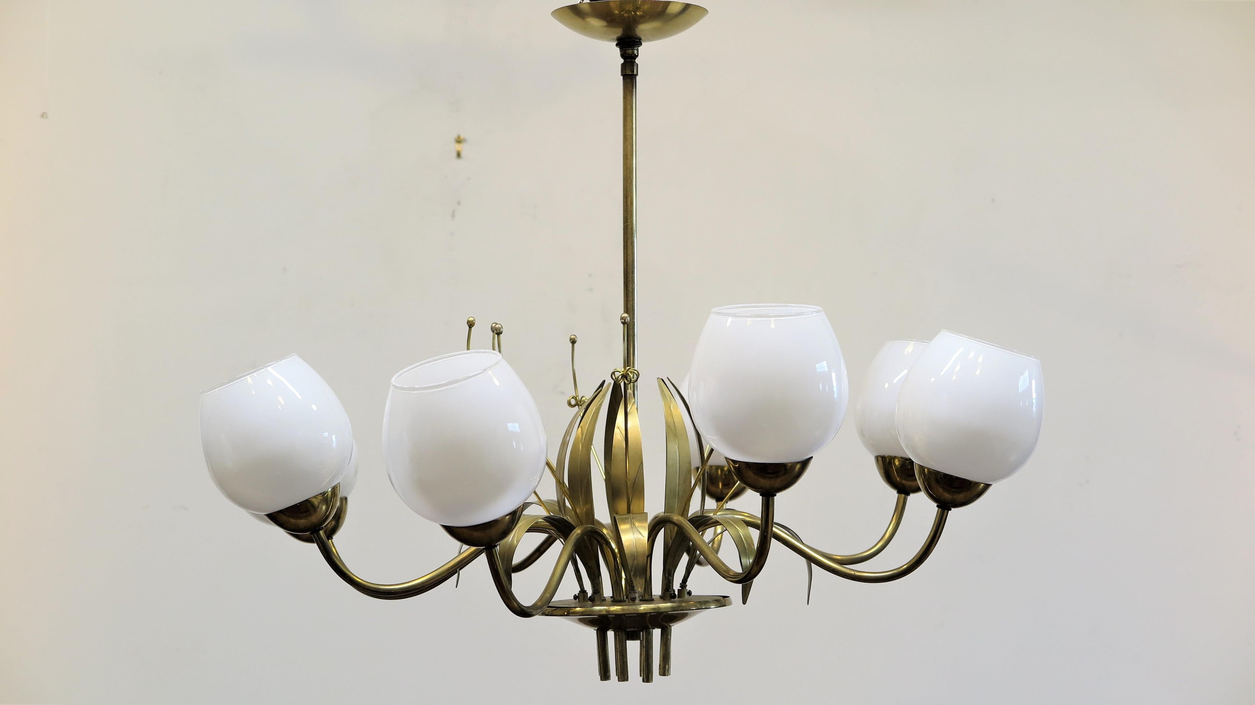 Brass chandelier designed by Paavo Tynell for Glashutte Limburg of Germany.
Eight arm chandelier with lotus type floral metal work. Very good condition wired for USA.
Scandinavian Modern, Mid-Century Modern.
