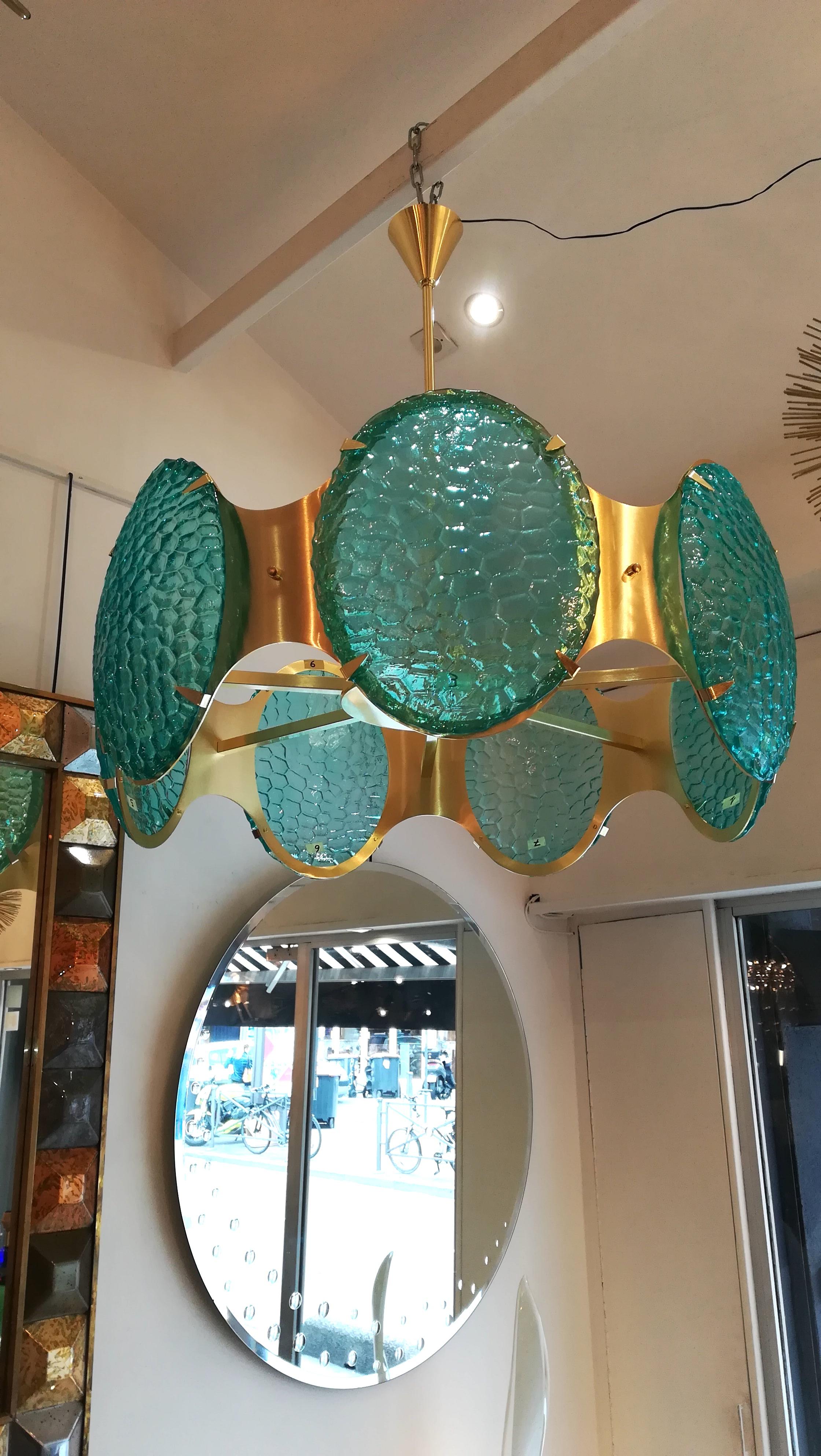 Brass chandelier with green Murano glass cabochons.