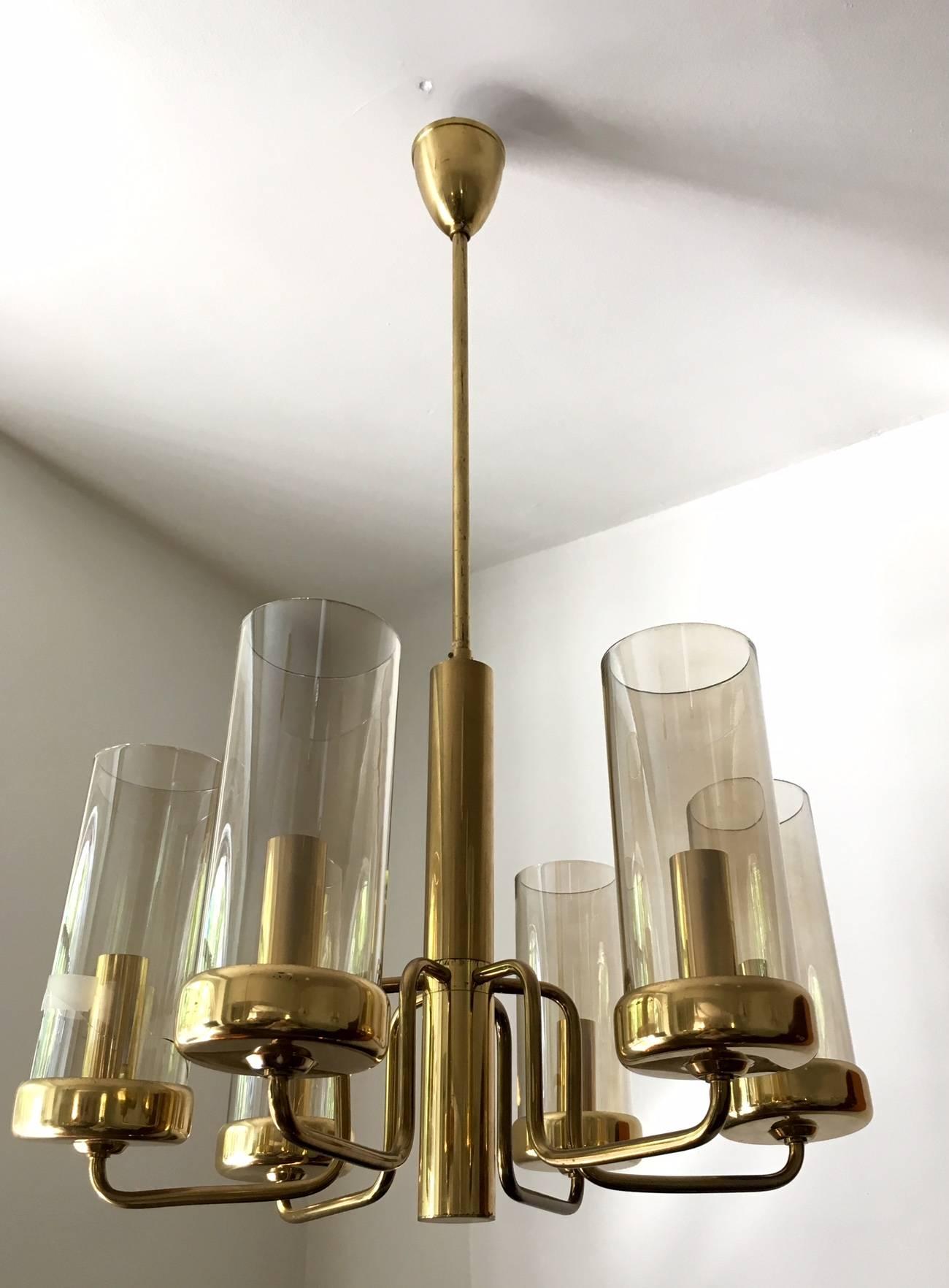 Beautiful brass ceiling lamp with six-light arms. Cylindrical slightly tinted glass globes. Please note that one glass cylinder has a crack. In the style of Hans-Agne Jakobsson.