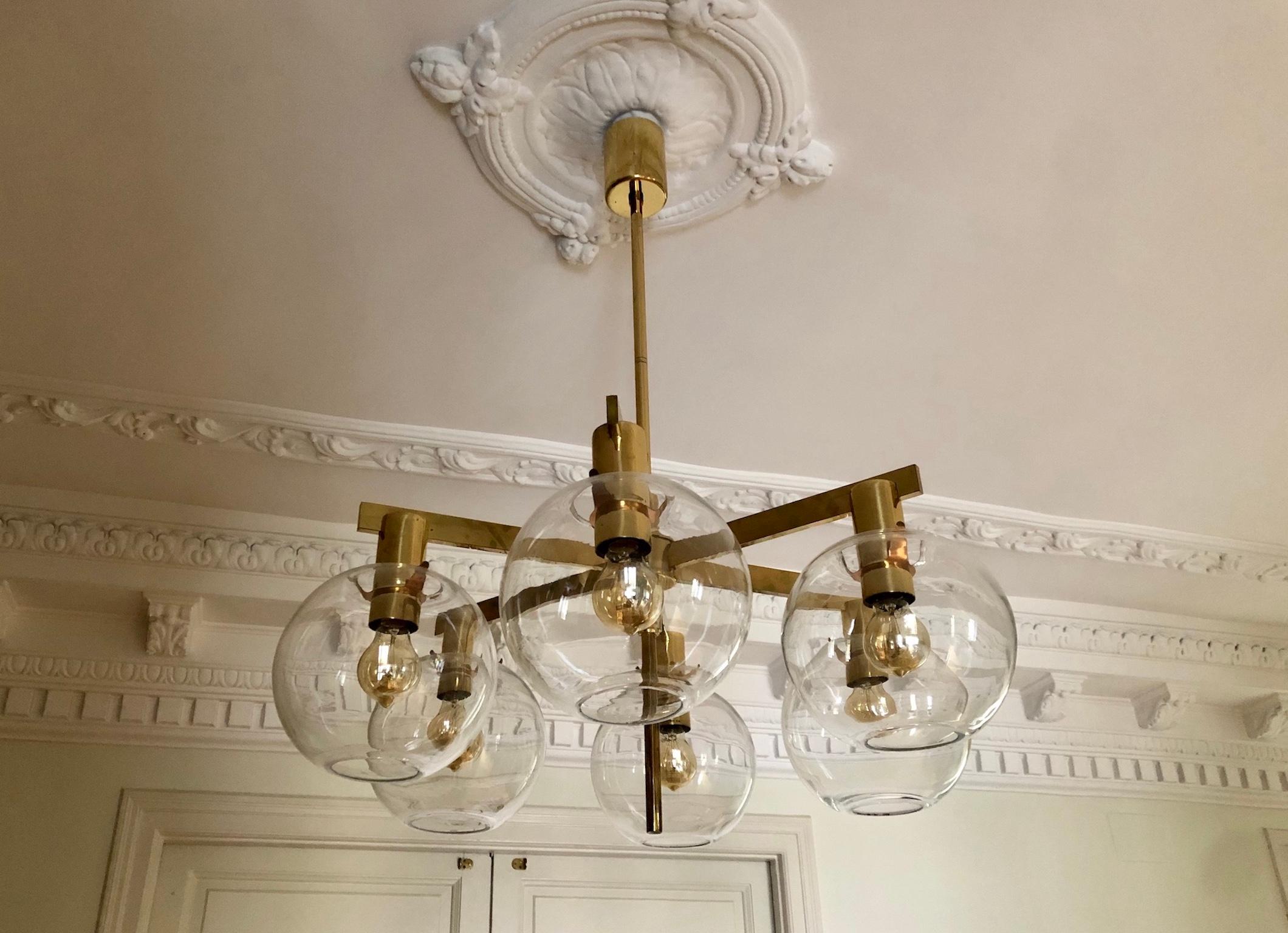 Brass ceiling lamp with six arms and round glass globes, model T-348/6, designed by Hans-Agne Jakobsson and produced in his studio in Markaryd, Sweden. Labelled.