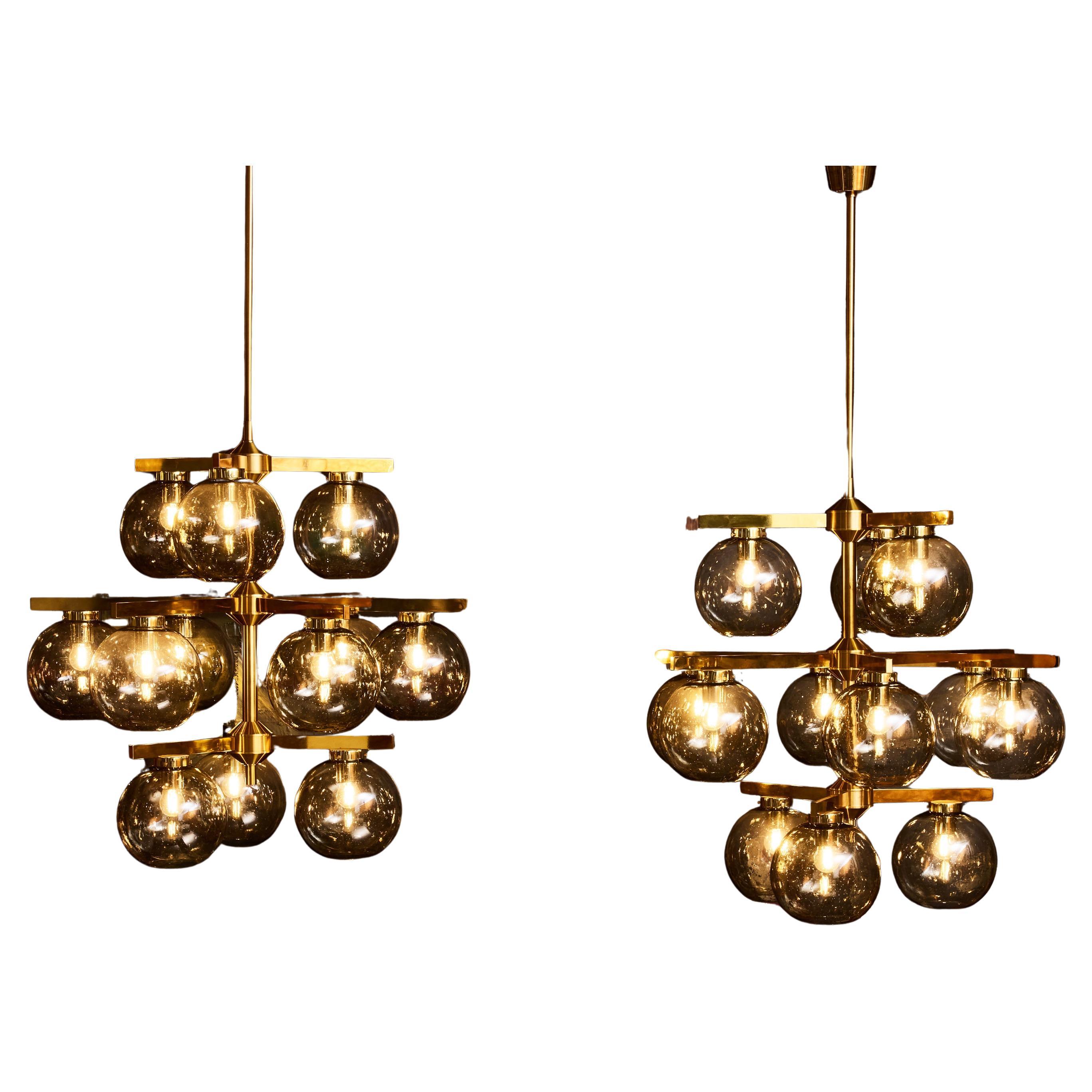 Lampadari in ottone con globi di vetro fumé di Holger Johansson per Westal