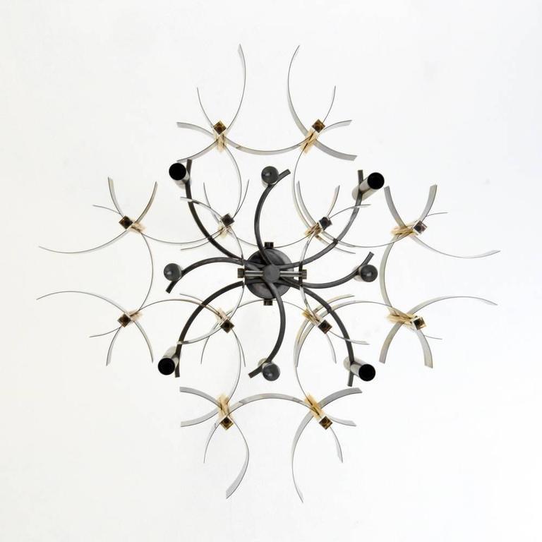Brass, chrome and Lucite chandelier by Gaetano Sciolari, Italy, circa 1970. Beautiful from any angle, this piece is in original condition as was sourced from Eva Gabor's former estate designed by Arthur Elrod. Downrod measures 17