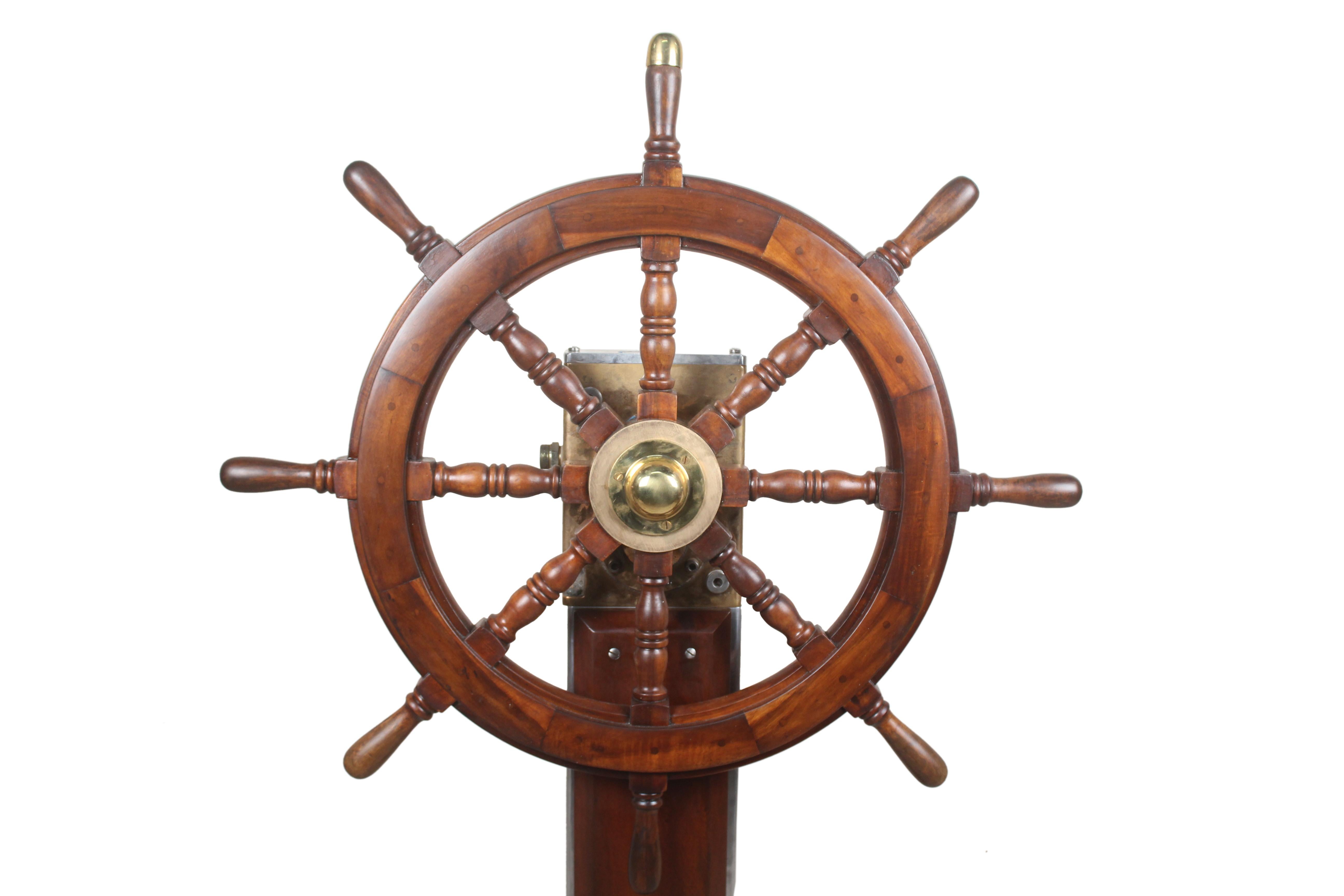 A rare find, this Norwegian teak, brass and chrome steering column with teak ship's wheel. Midcentury. The 12