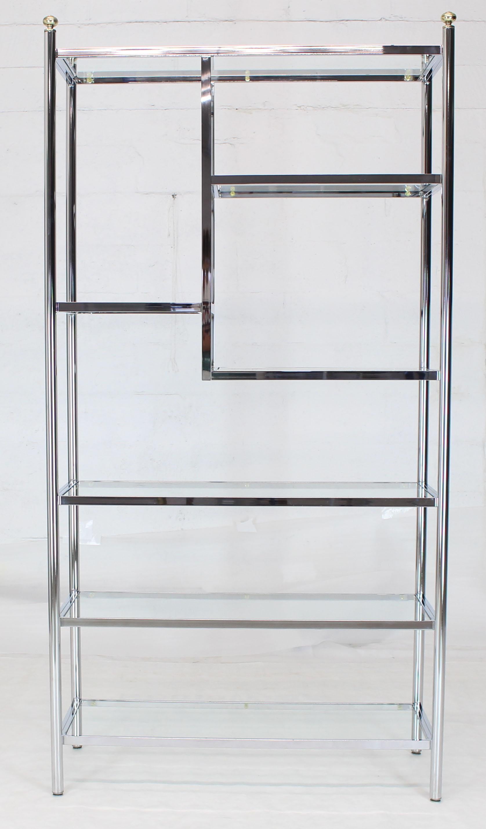 Mid-Century Modern large, staggered configuration brass chrome and glass étagère.