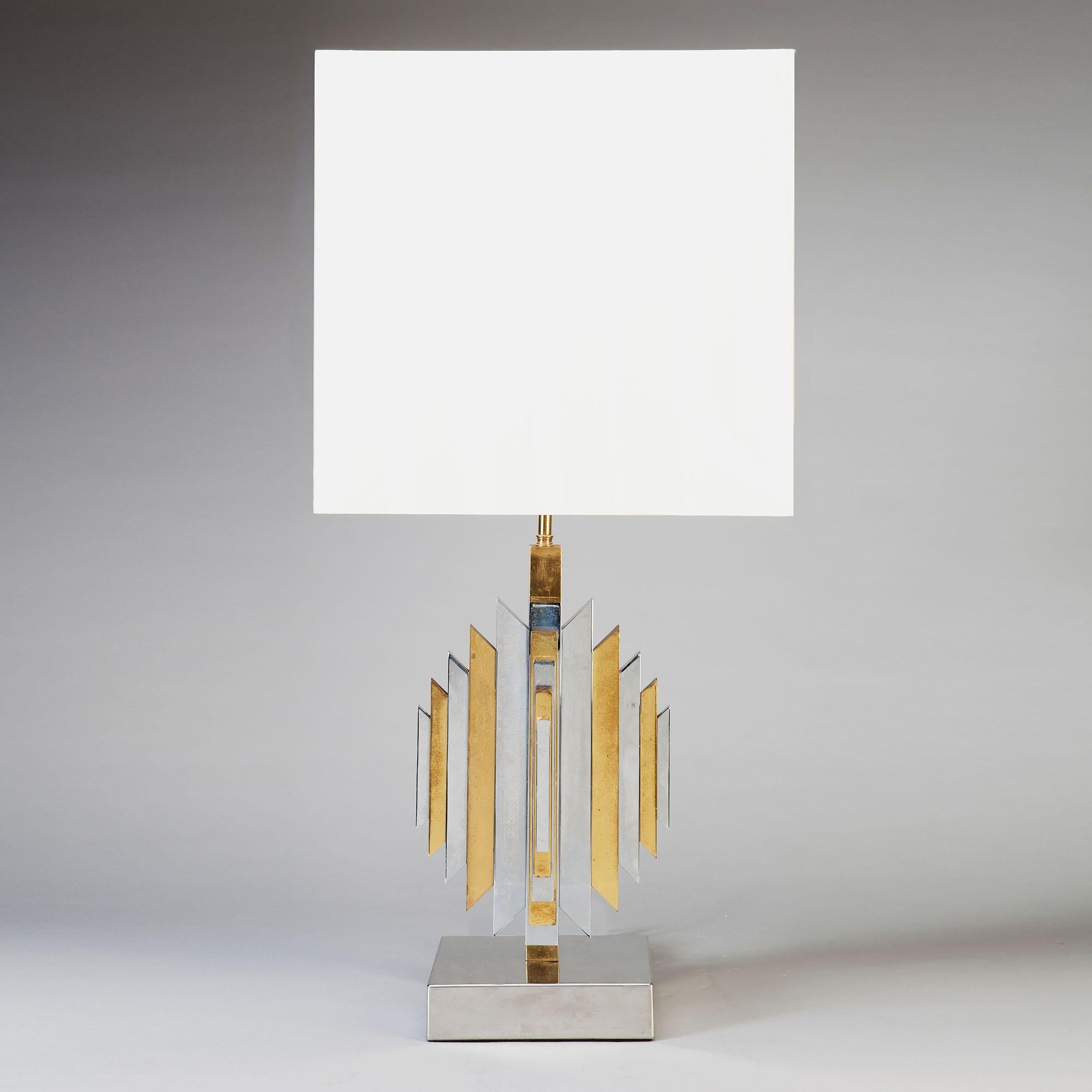 Brass Chrome Vintage Table Lamp, attributed to Romeo Rega Italy, circa 1975

Romeo Rega style vintage table lamp in brass and chrome. Each face is decorated with chamfered end ascending length alternating panels of brass and chrome.

Additional