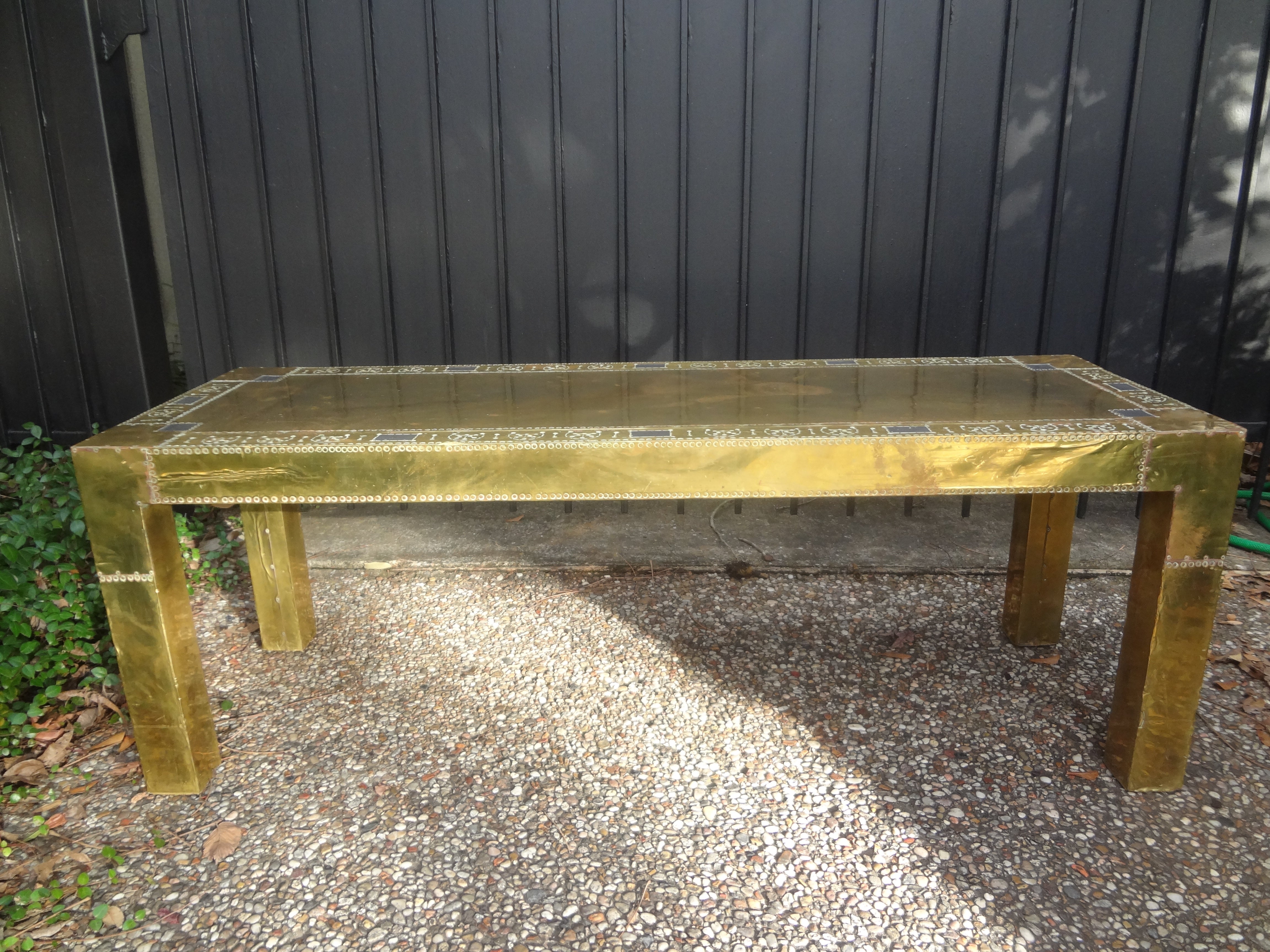 Brass Clad Coffee Table Or Bench By R. Dubarry.
Spanish hand hammered riveted brass clad coffee table in the Parsons style.
This handsome brass cocktail table could also be used as a bench.
This was created in the 1970's by Rodolfo Dubarry.