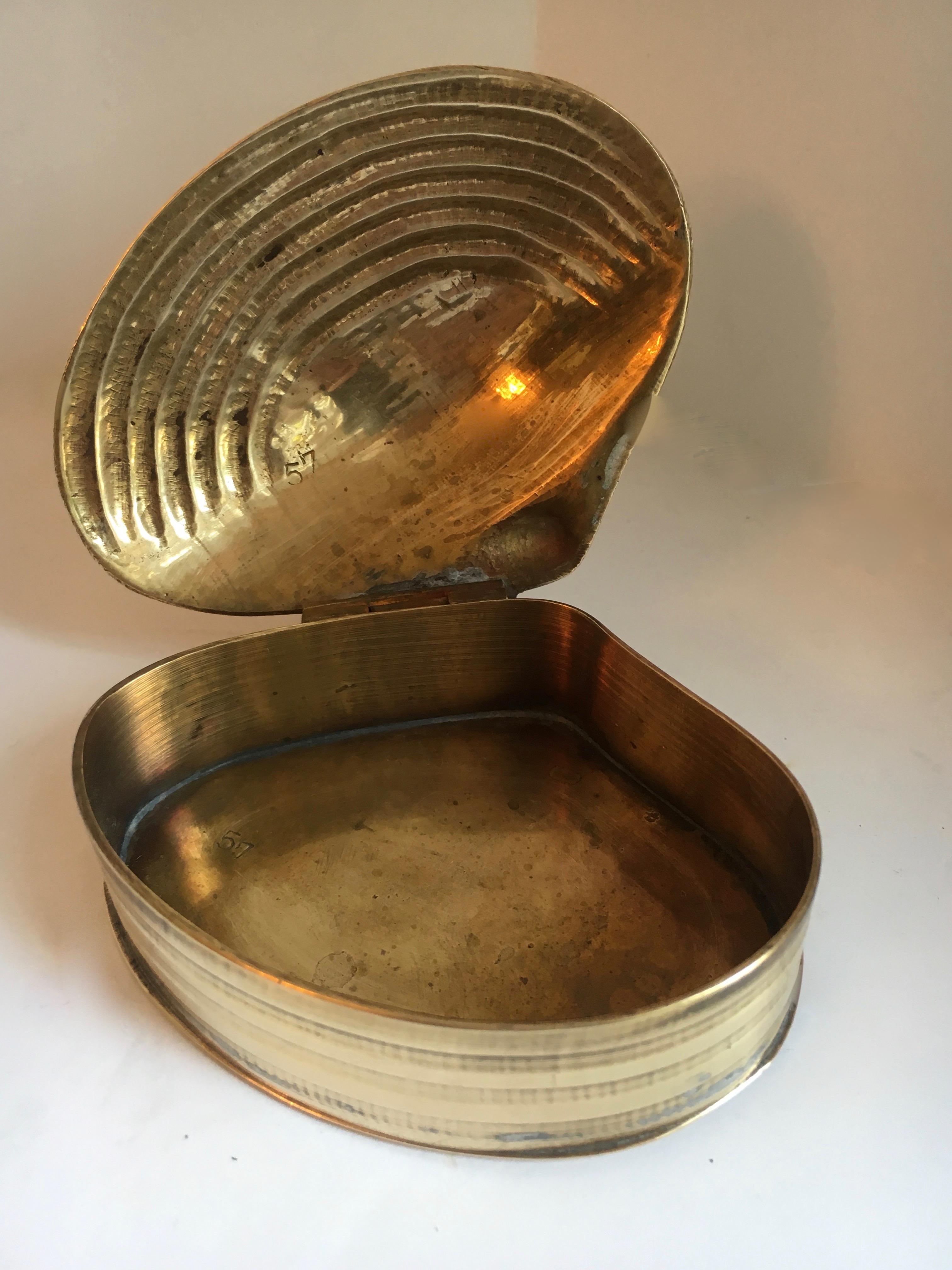 Brass clam shell box with hinged lid - to store everything from paper clips to diamond rings.