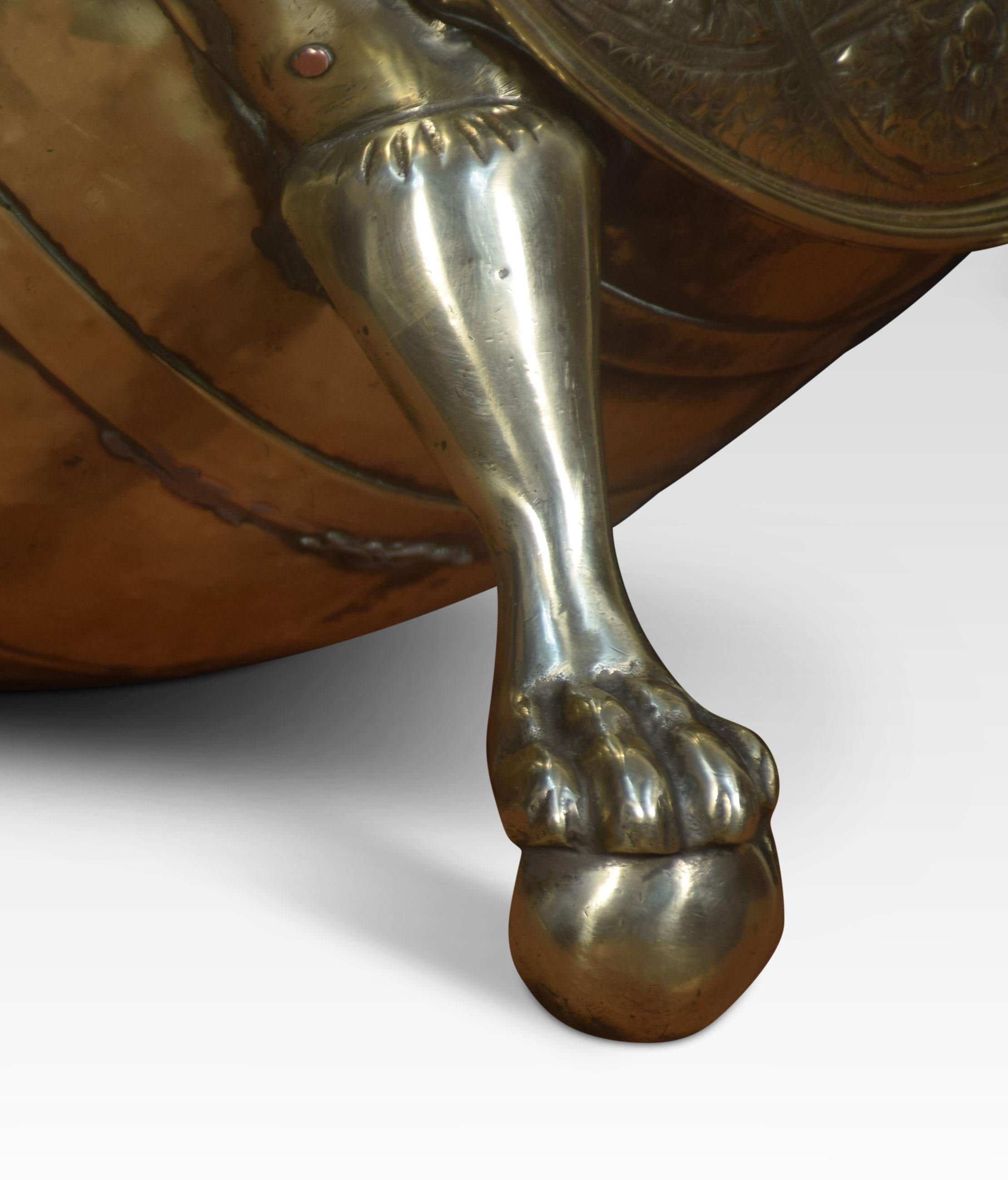 Brass coal bin with armorial lid decoration resting on ball and claw feet.
Dimensions:
Height 16 inches
Width 16 inches
Depth 12 inches.