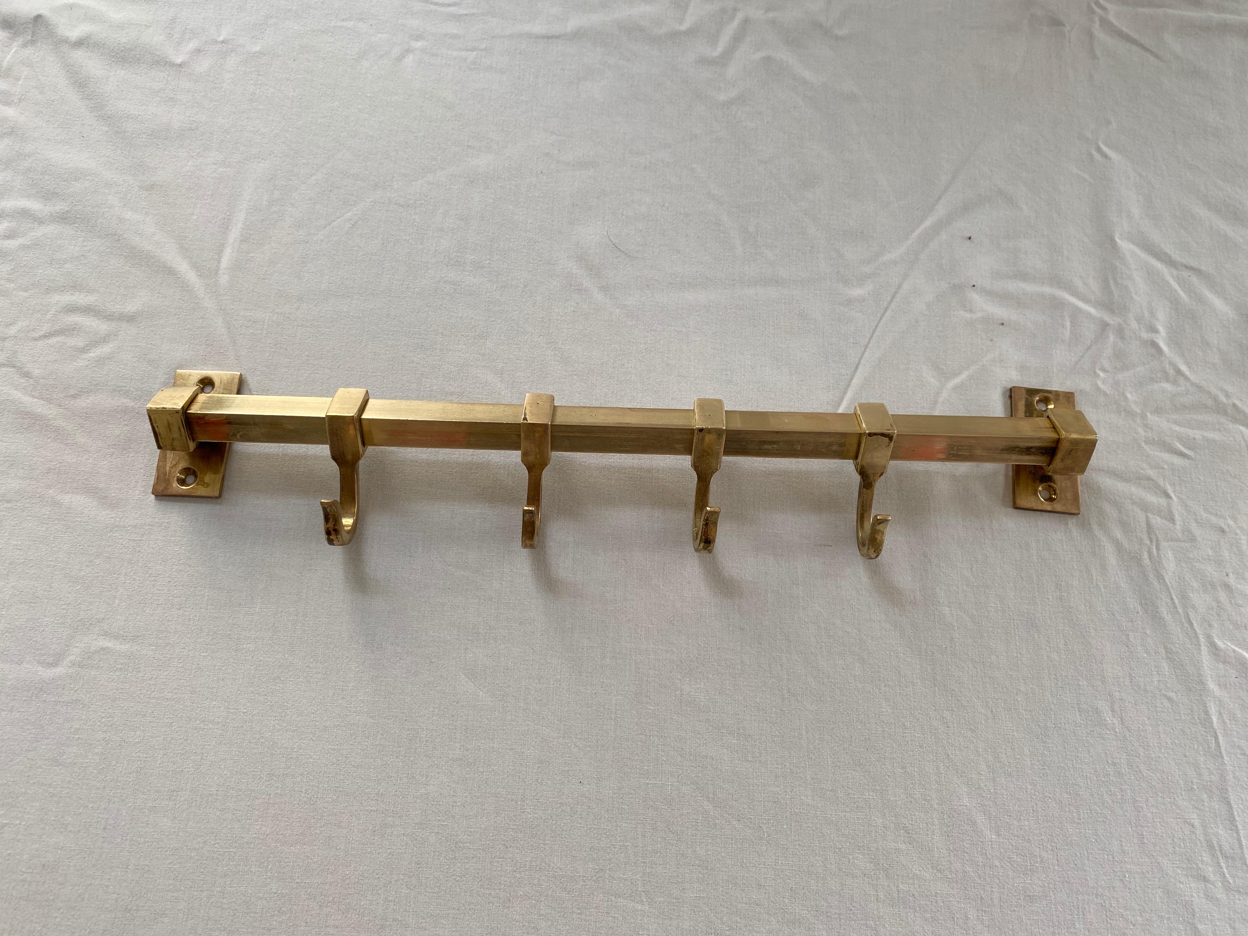 Austrian coat rack made in the 1930-1940. Brass hangers on brass bar.
The length is 42cm and it is 3cm deep.
 