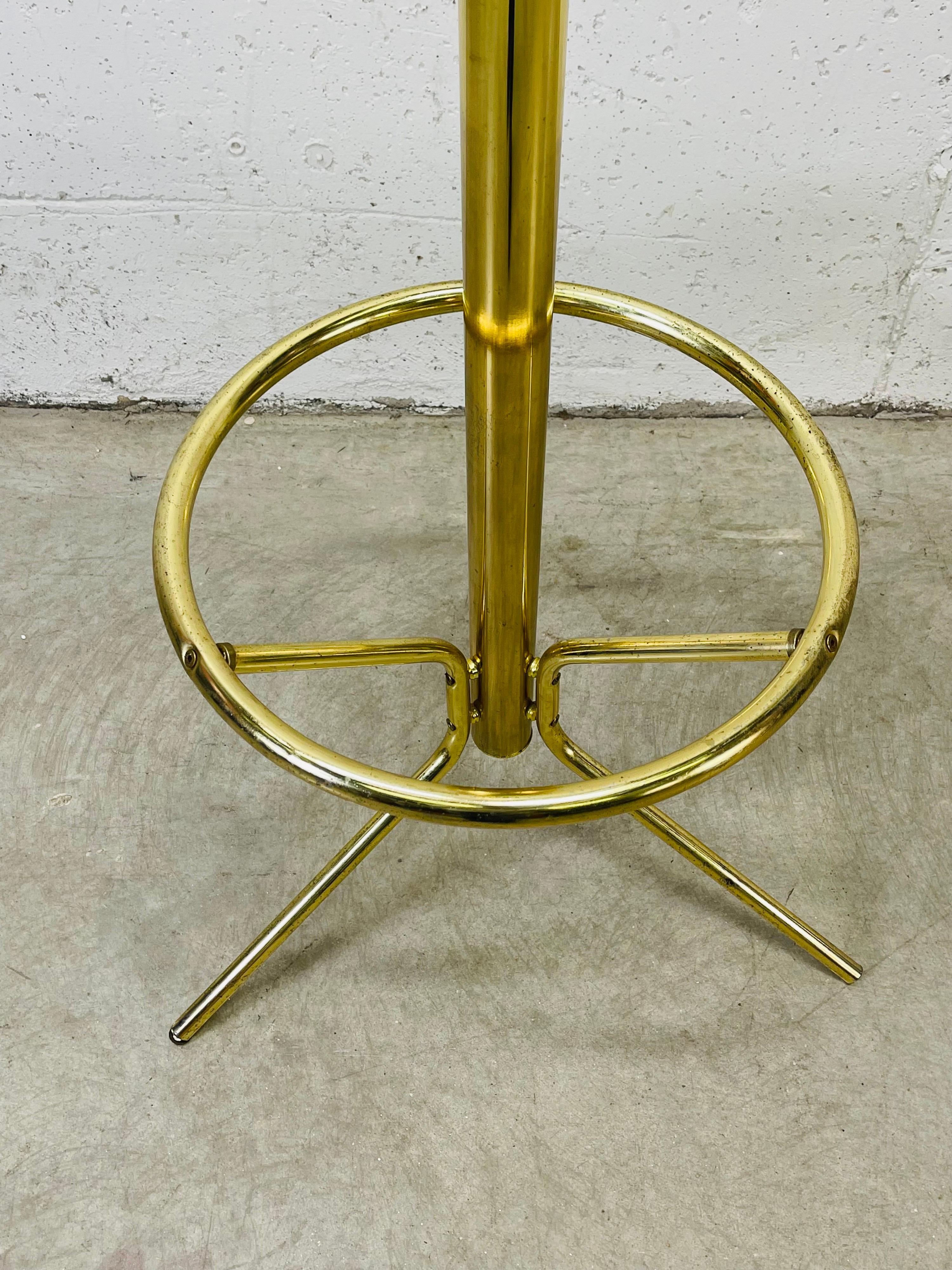Vintage 1970s tall brass coat and hat rack. The rack has a rounded base and is sturdy. Tarnish from age. No marks.