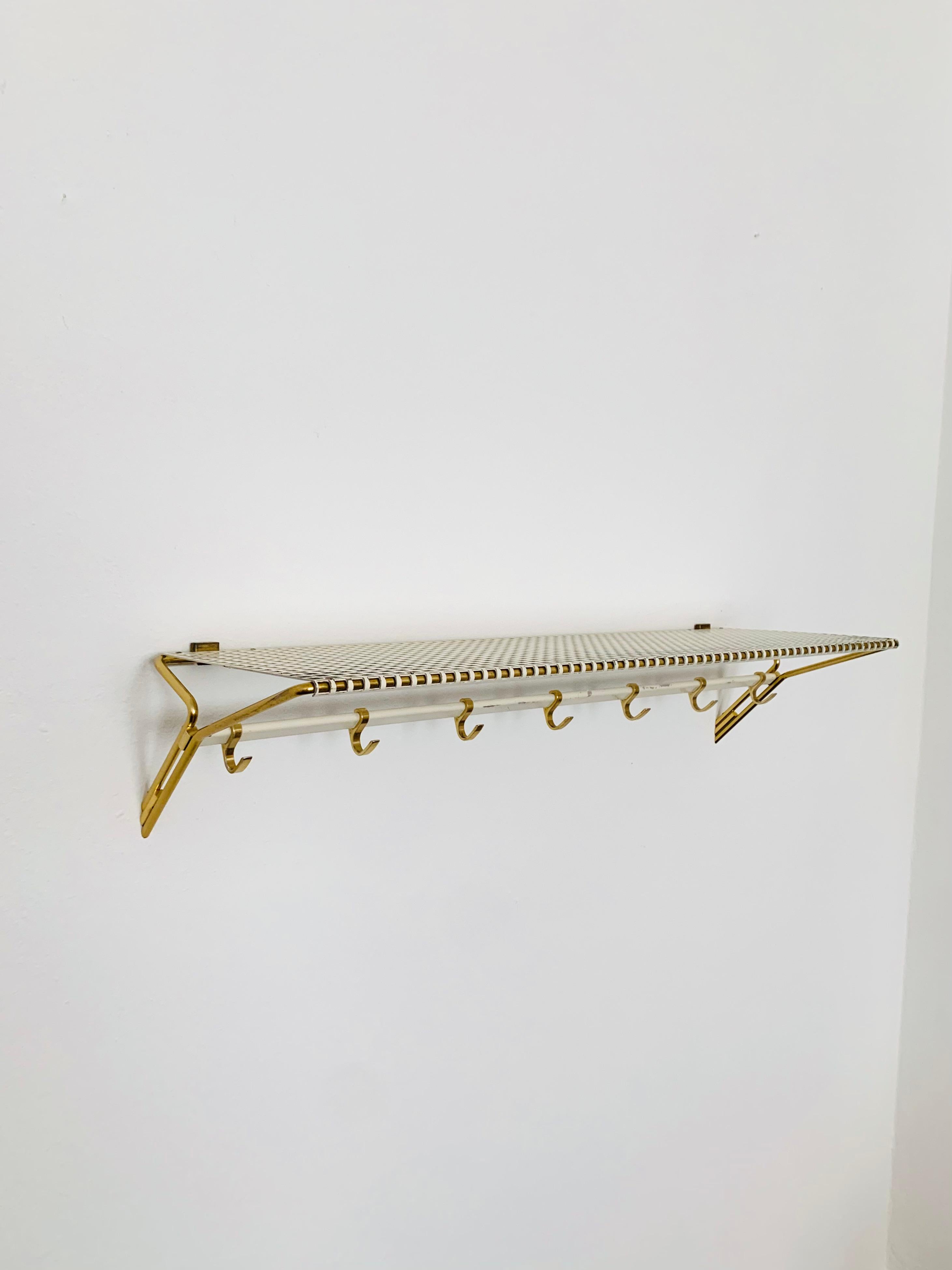 Beautiful and rare coat rack from the 1950s.

Wonderful high-quality workmanship and an absolute favorite piece.

Condition:

Very good vintage condition with slight signs of wear and tear due to age.

Signs of use and patina.
Some scratches and