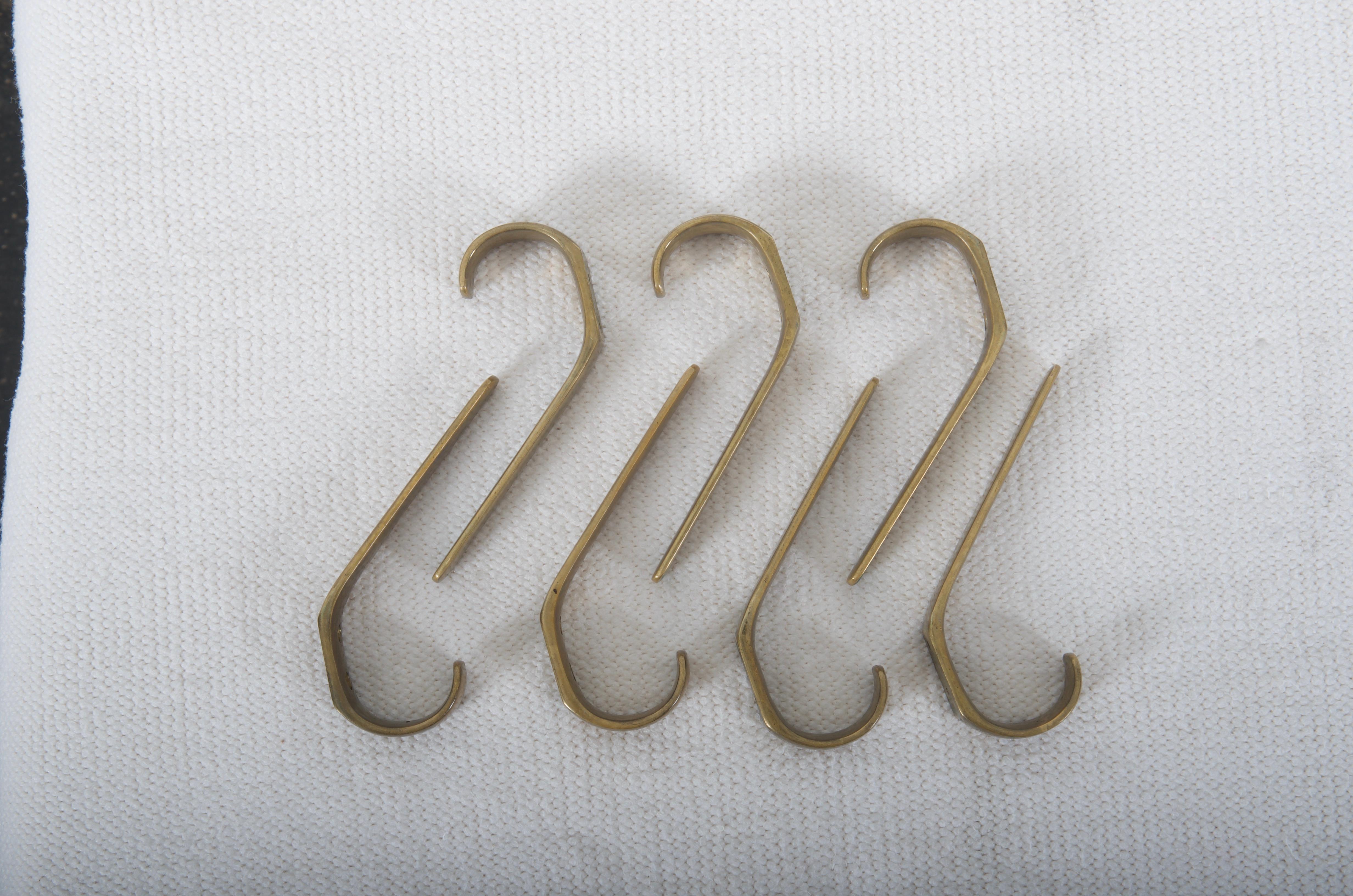 Brass hooks manufactured in Austria in the 1950s.
 