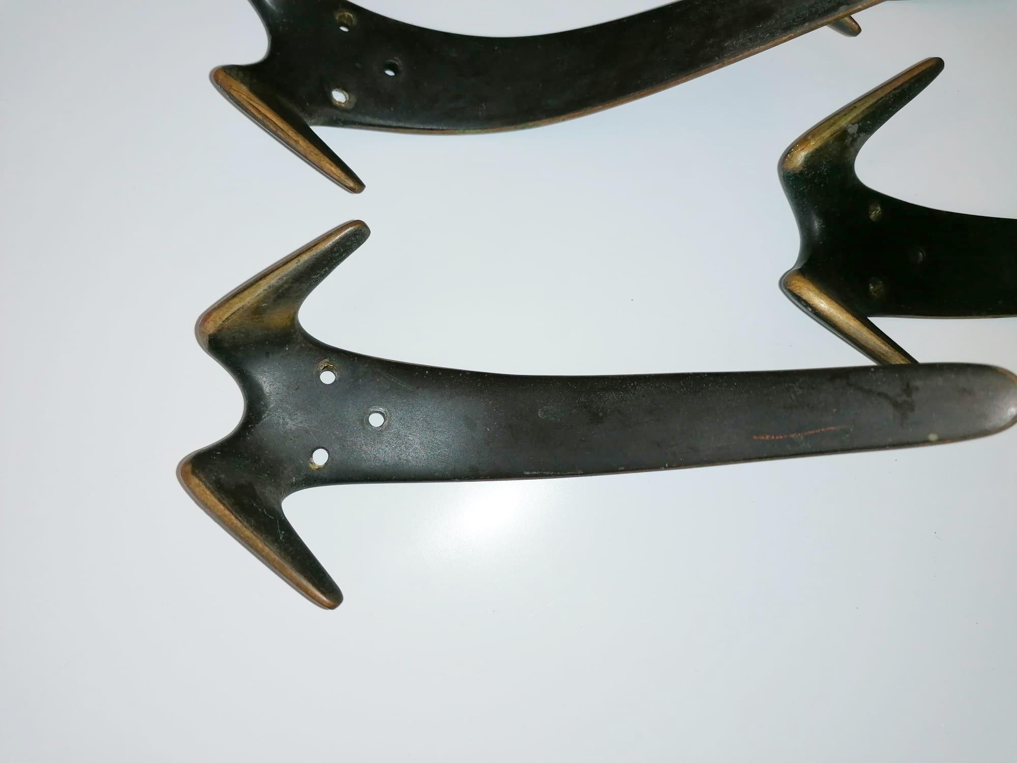 Brass hooks manufactured by Carl Auböck in Austria in the 1950s.
price per hook.