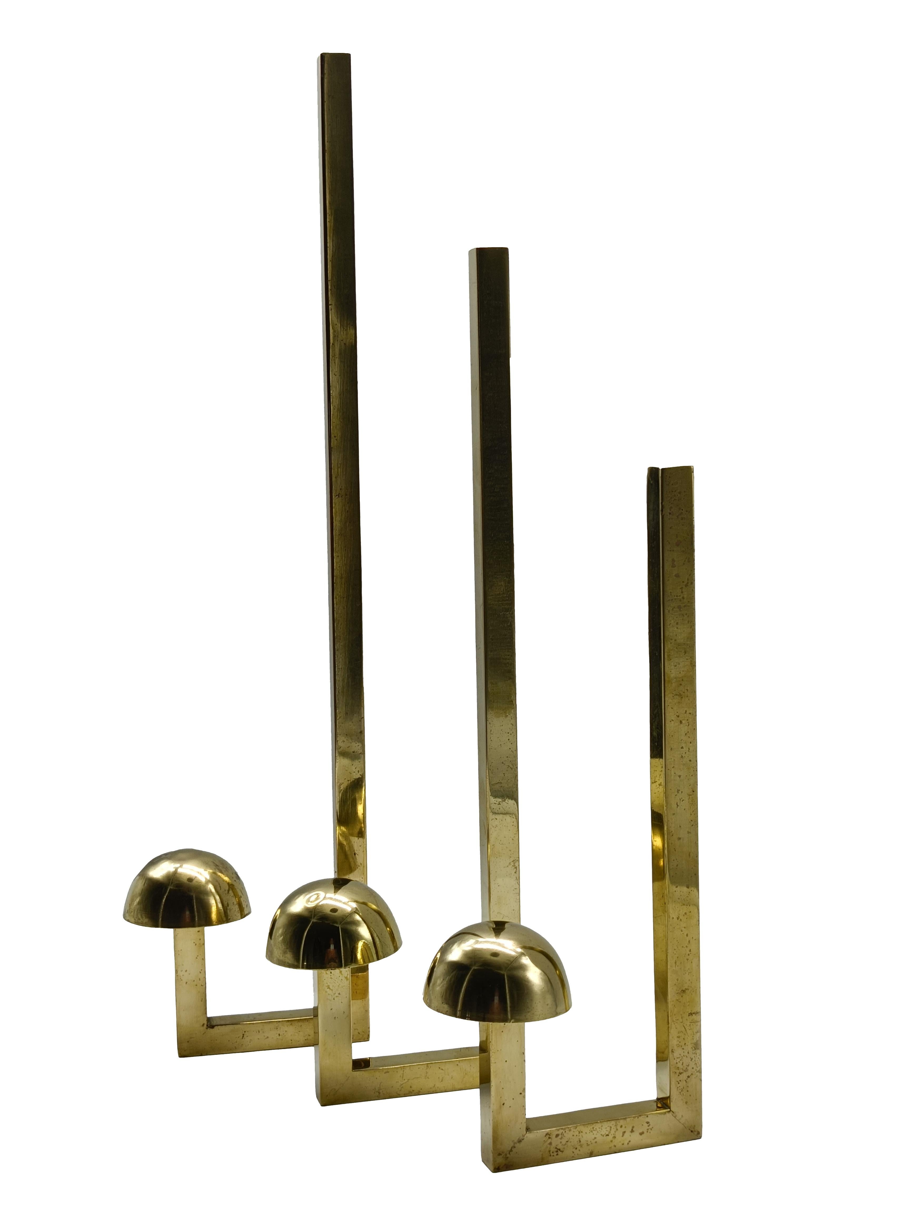A set of three large and unusual brass wall hooks, handcrafted in the 1960s. Gently polished by hand, in excellent condition with nice patina. 
They have different sizes:
The large cm. 50 x 10 x 7.5
The middle cm. 40 x 10 x 7.5
The small 30 x 10 x