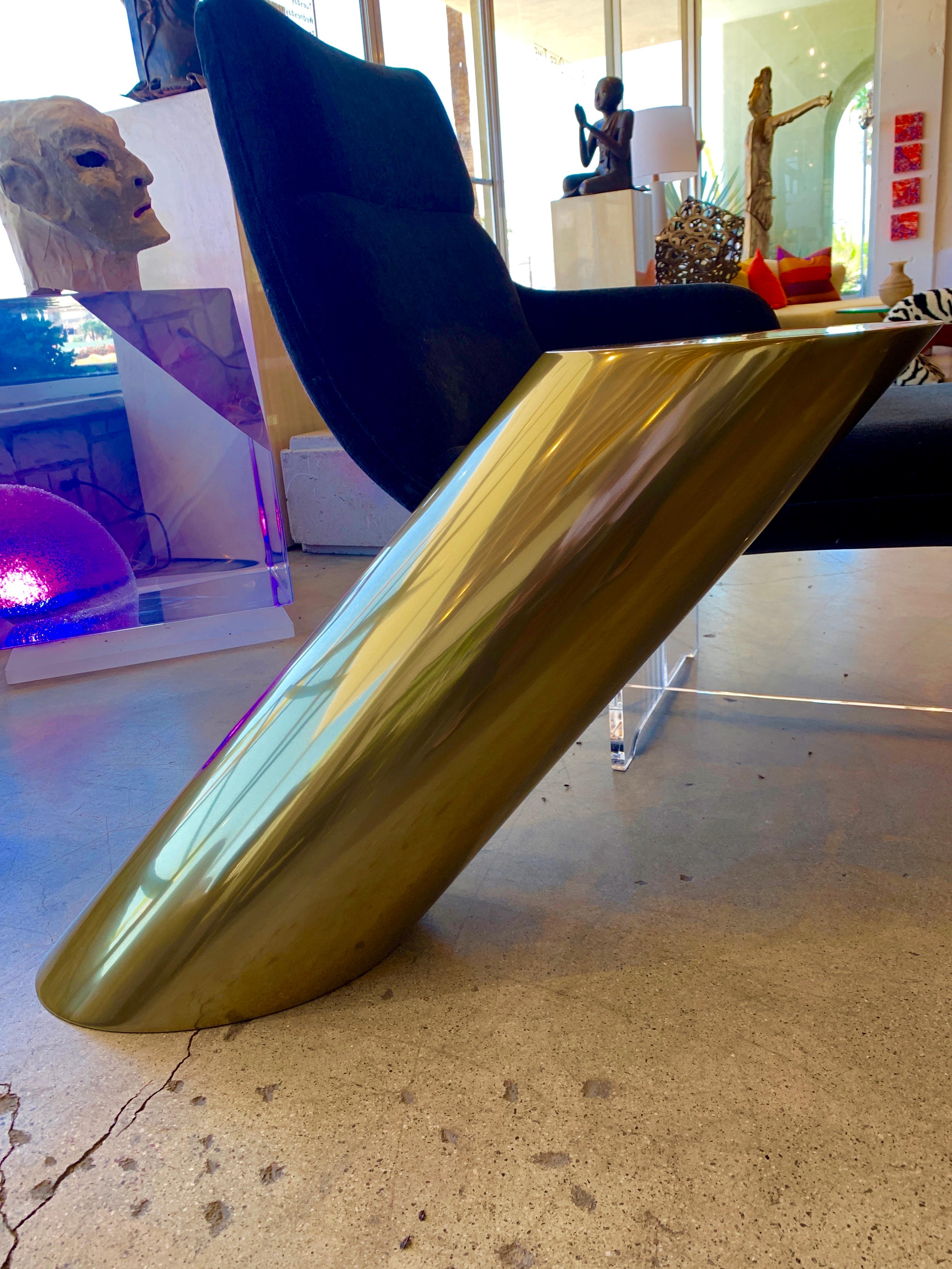 A nice metal cylinder table with a brass coated finish. The table has a surface dimension of 14 by 10 inches. The height is 21 inches. This table is new with minor handling marks.