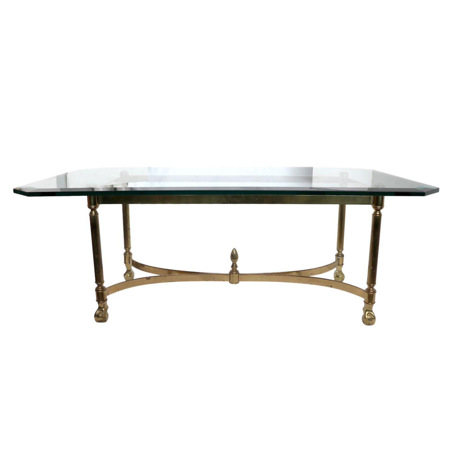 A vintage coffee table with a glass top. A wonderful addition to your living space. Minimal wear to the glass.