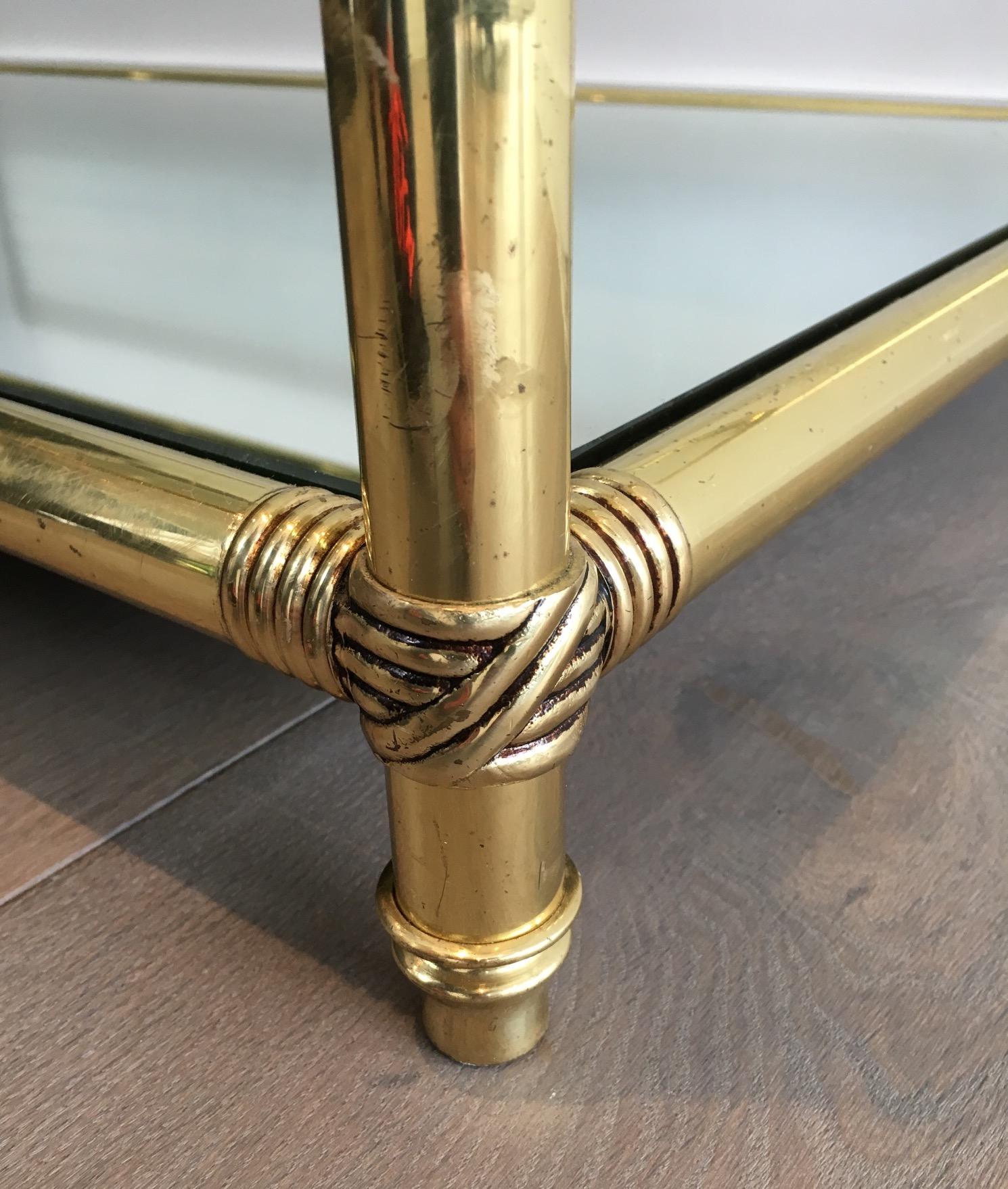 Brass Coffee Table with Brass Noodles on Corners, Clear Glass Shelf on Top and 3