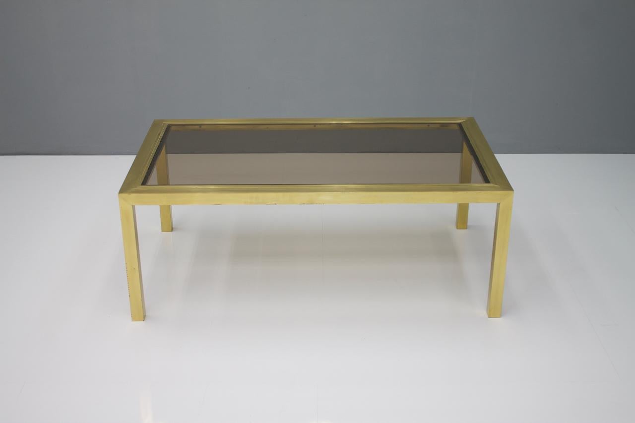Brass coffee table with glass 1960s.
  
   