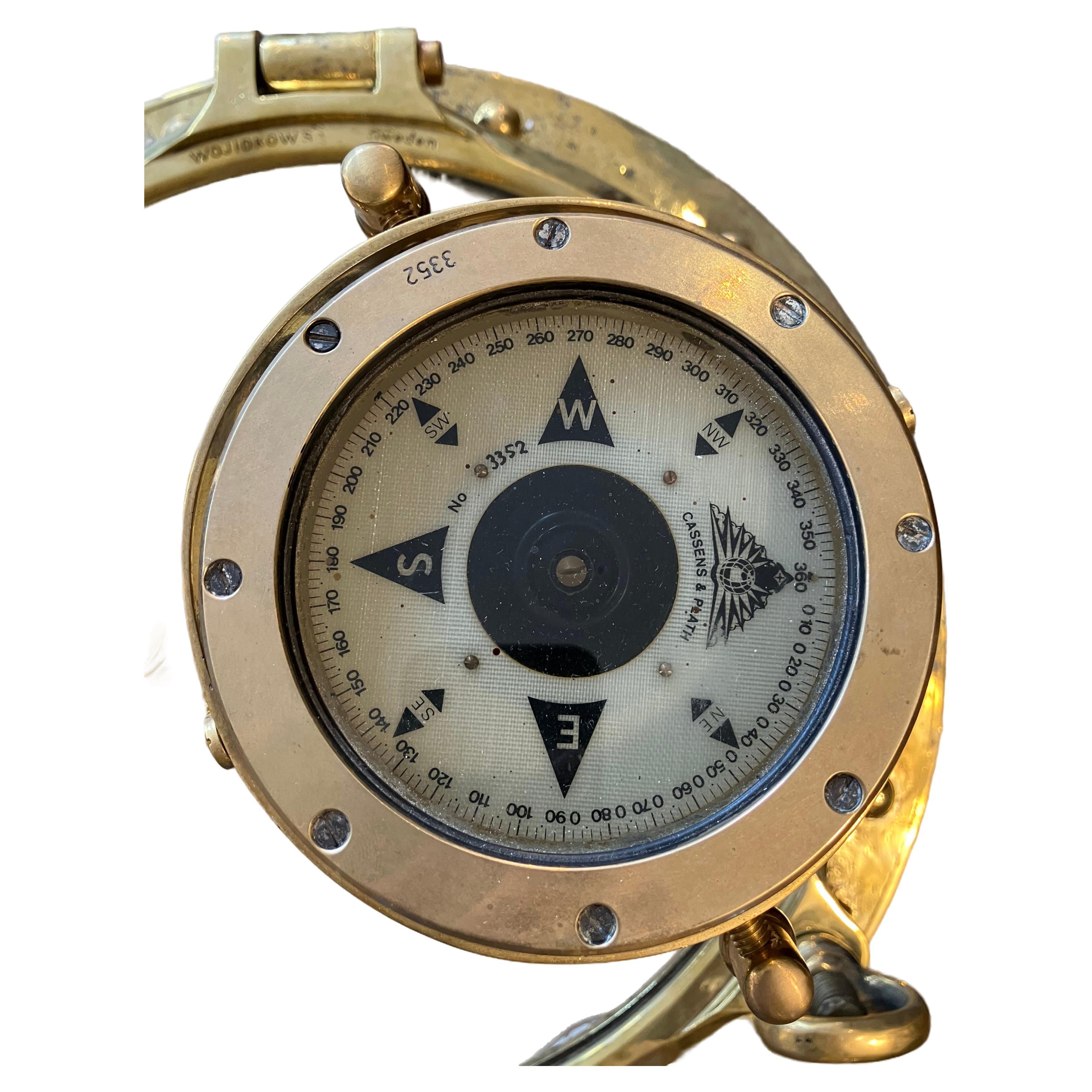 A ship's brass English compass from a decommissioned lifeboat.  This is made by Cassens and Plath, an English company.  An important nautical navigational instrument used when underway.  We had it mounted onto a Y-frame in order for it to continue