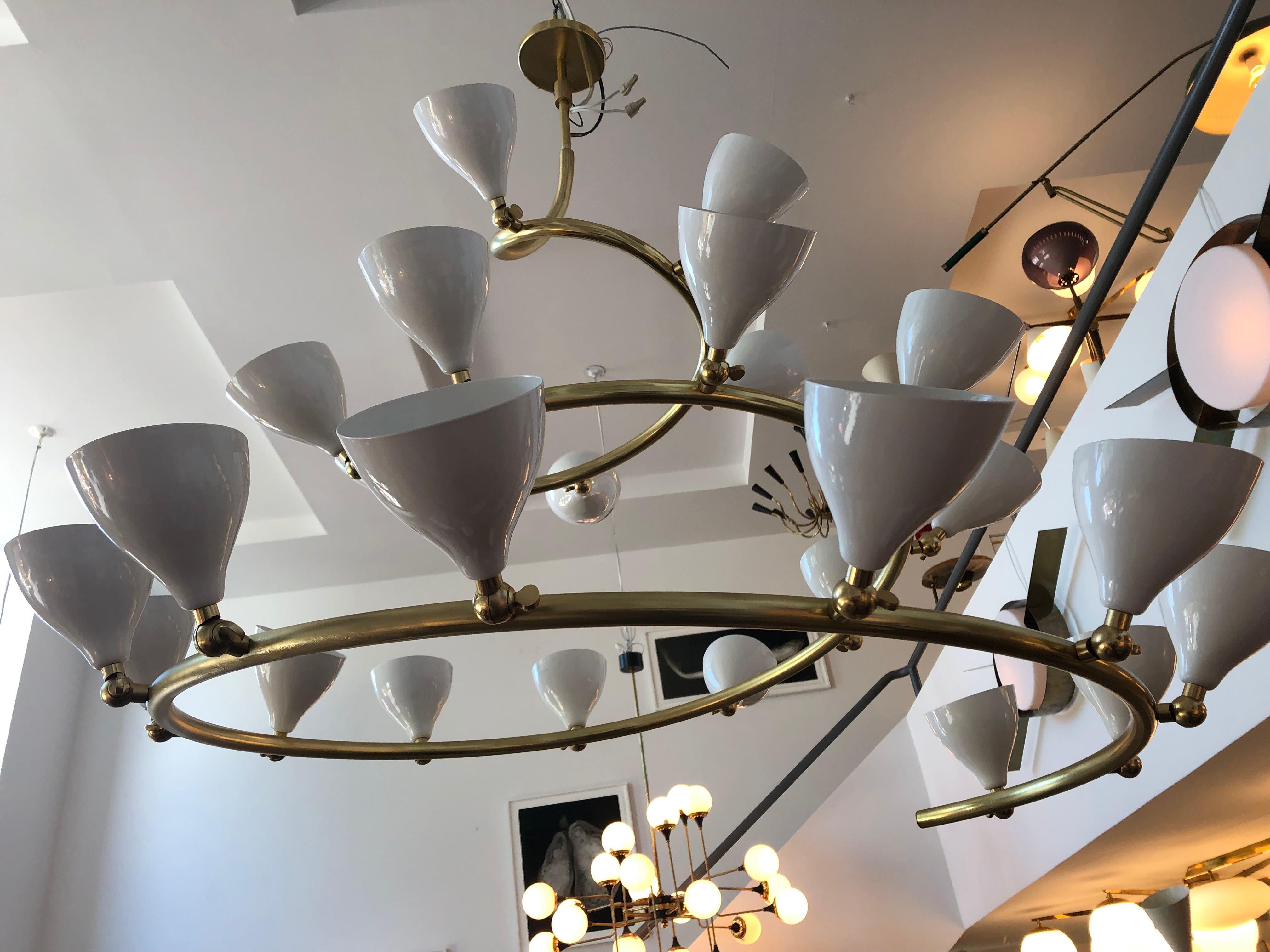Large scale Spiral Chandelier in the style of Arteluce, inspired by Gino Sarfatti's model 2040 (1948).
This chandelier features 23 lights with off-white lacquered cup reflectors with adjustable ball joints uniquely mounted on 3/4