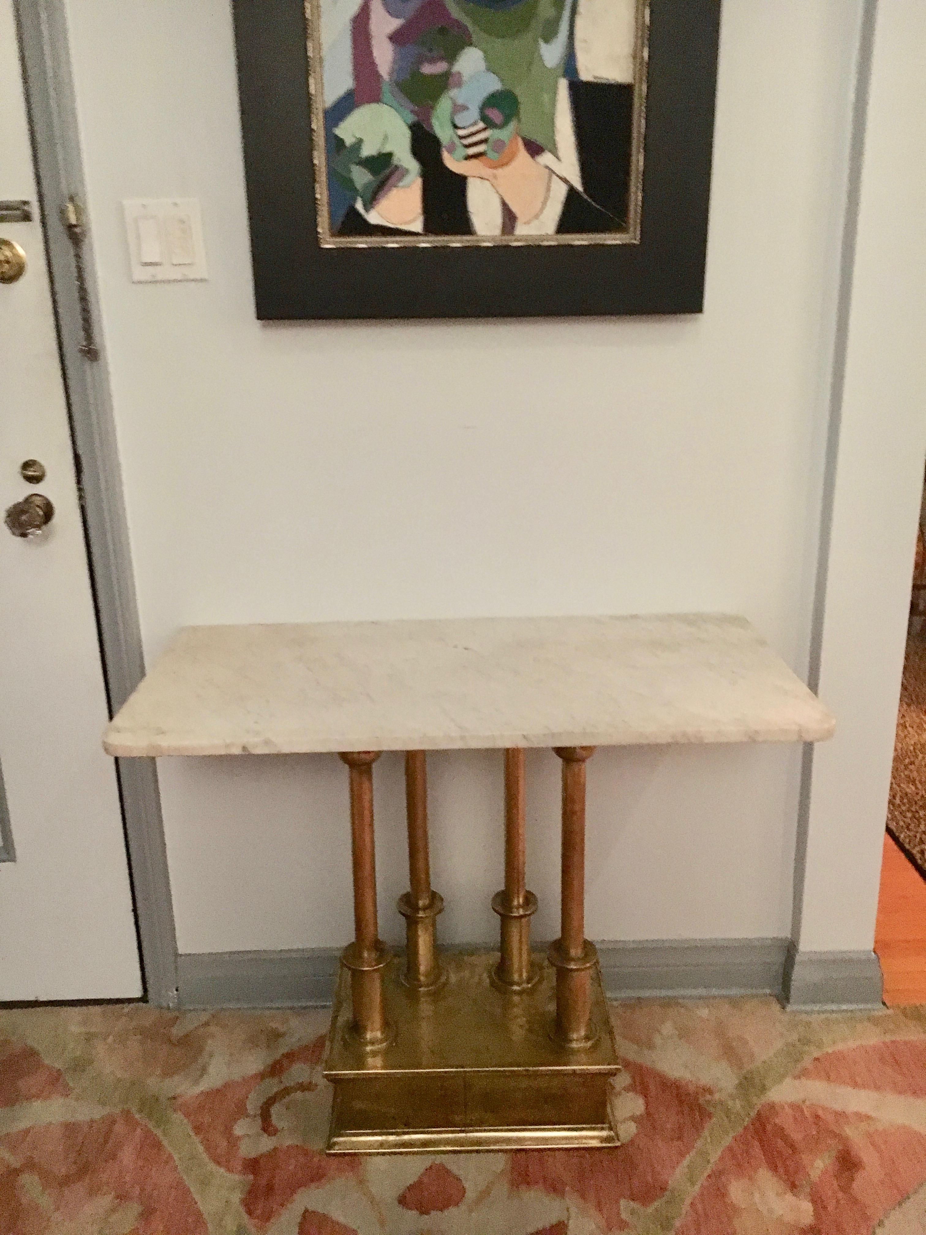 Brass console table with marble top - a unique and handsome brass base console with four uniquely designed stations to hold the top.