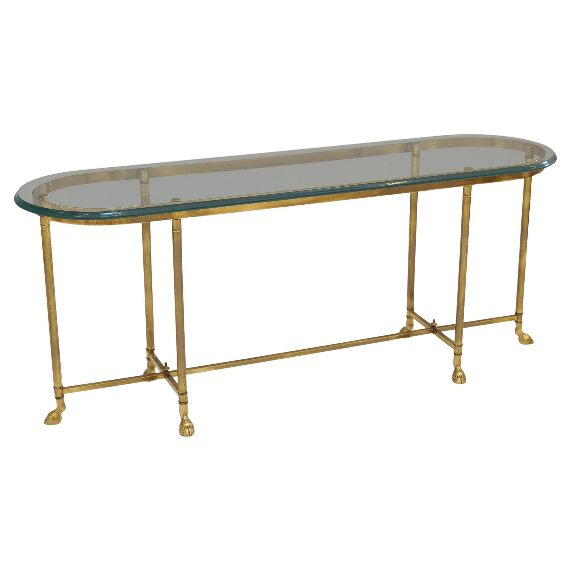 brass console table with profiled glass & brass hoofs La Barge