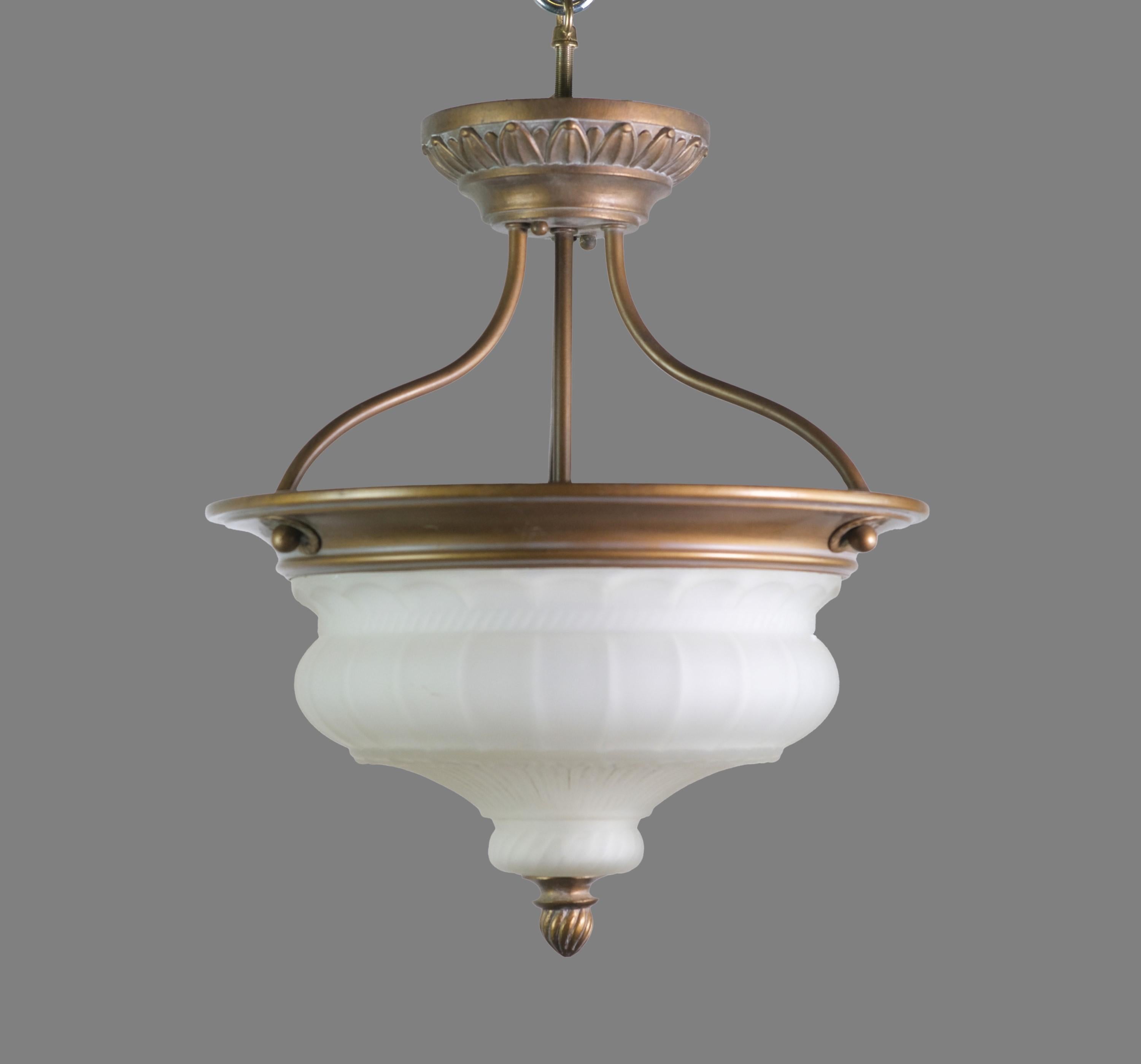 Classical style semi flush pendant ceiling light. Made of brass with a copper wash finish. Cast white dish light shade with a petal deisgn. Cleaned and restored. This has three standard medium base E26 sockets. This can be seen at our 400 Gilligan