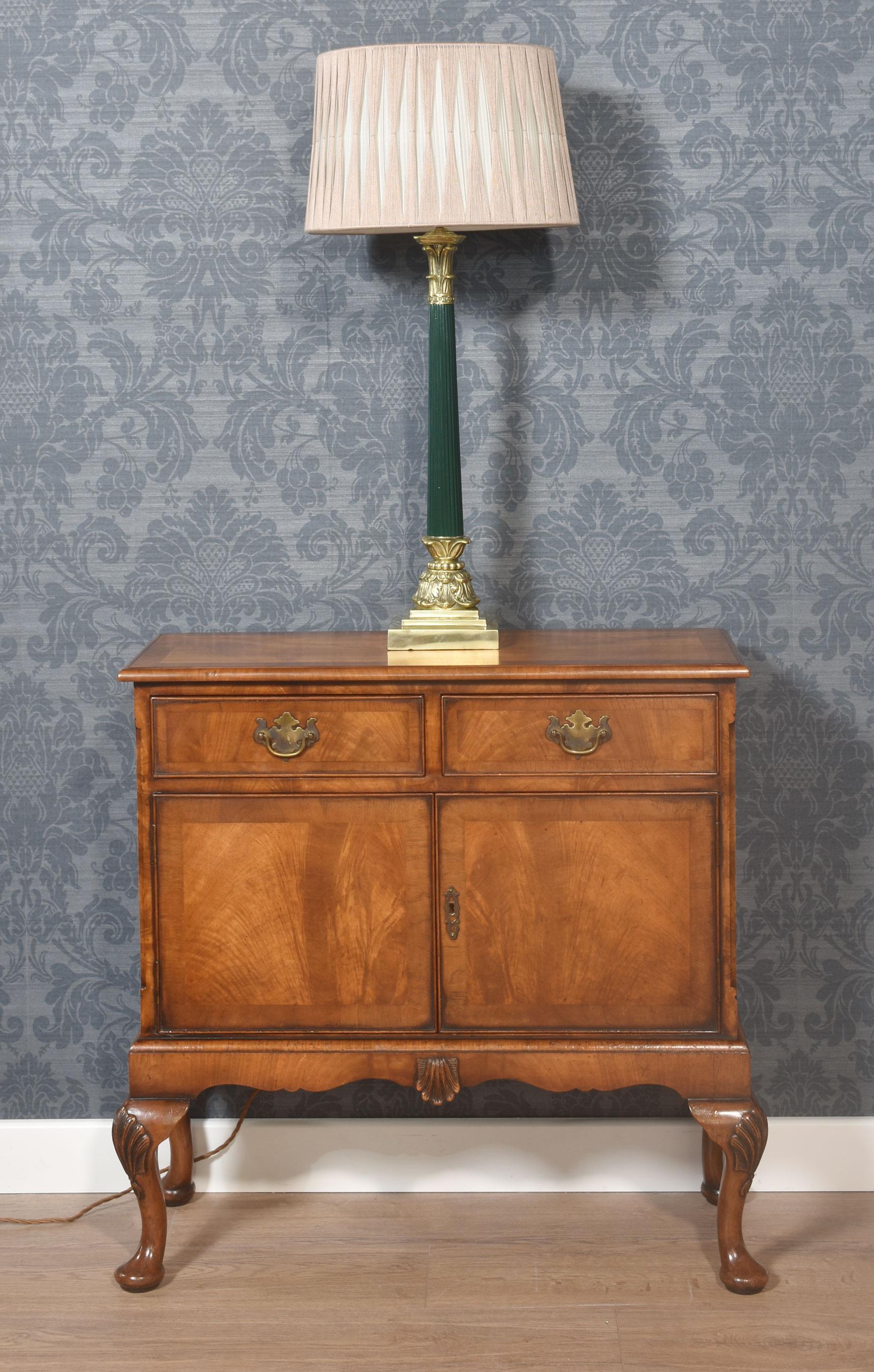Brass table lamp, having a fluted Corinthian column, raised on a stepped square base with leaf detail. The lamp has been rewired and tested.
Dimensions
Height 23.5 Inches
Width 5.5 Inches
Depth 5.5 Inches