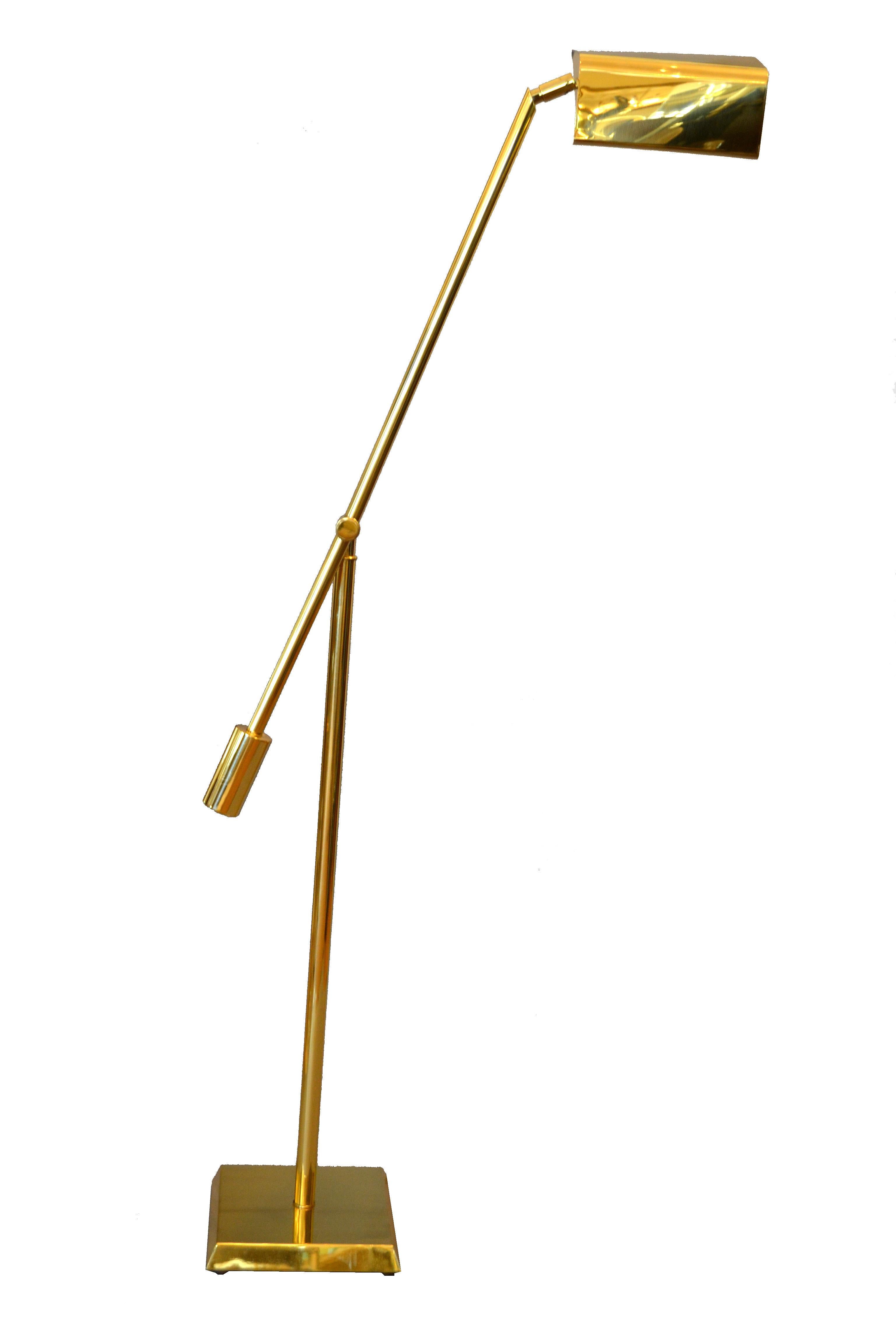 We offer a brass counter balanced floor lamp with a triangular shade and integral brass switch raised on a tube pole and slanted square base by Chapman.
The floor lamp can be adjusted to different angles.
Wired for the U.S. in perfect working