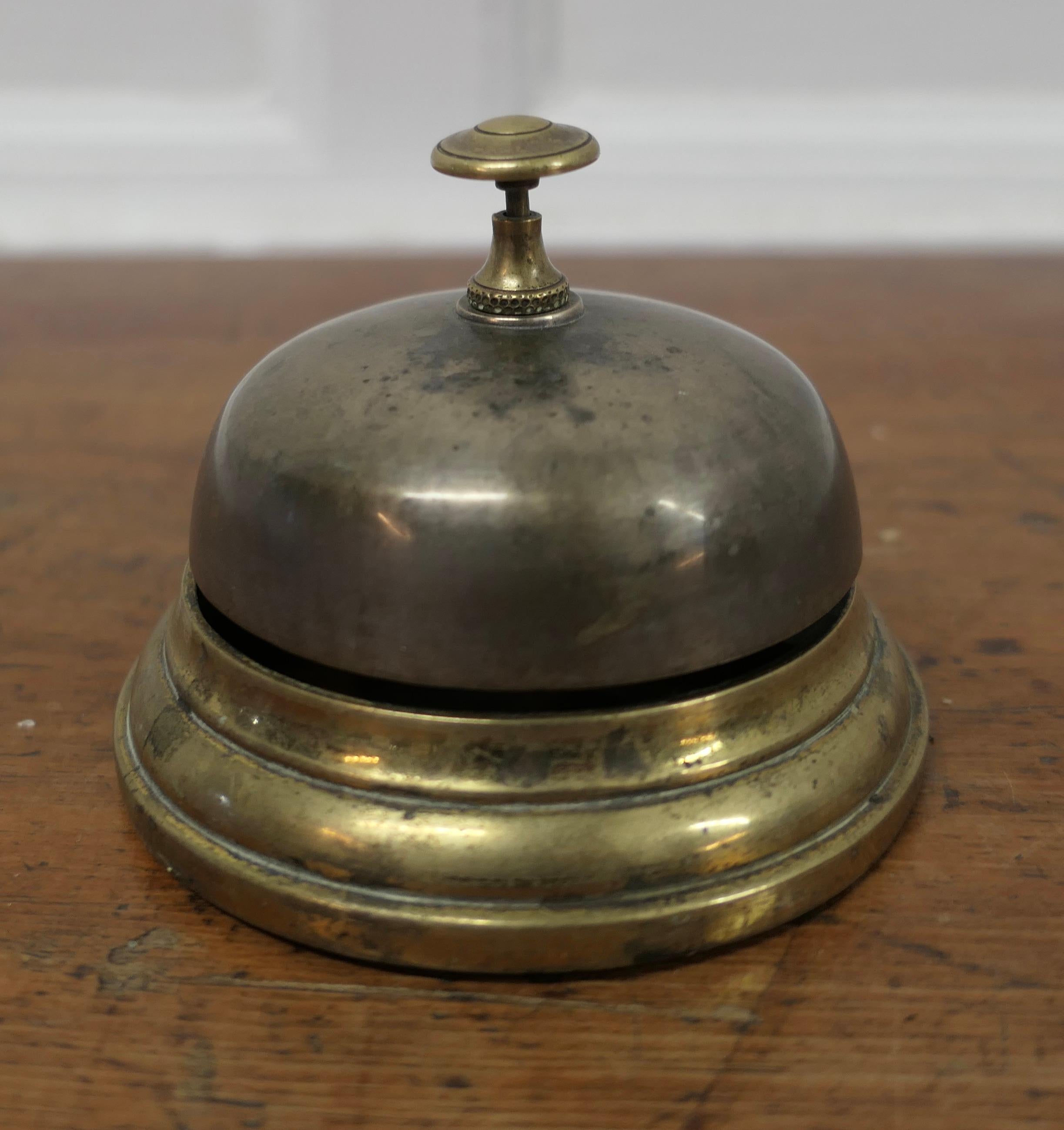  Brass Counter Top Courtesy Bell, Reception Desk Bell

Made in solid brass, in good condition and ready to use with a demanding ding, the bell is 4.5” in diameter and 3” high 
SW22