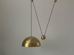 Lampada a sospensione a contrappeso in ottone di Florian Schulz, anni '70, Germania