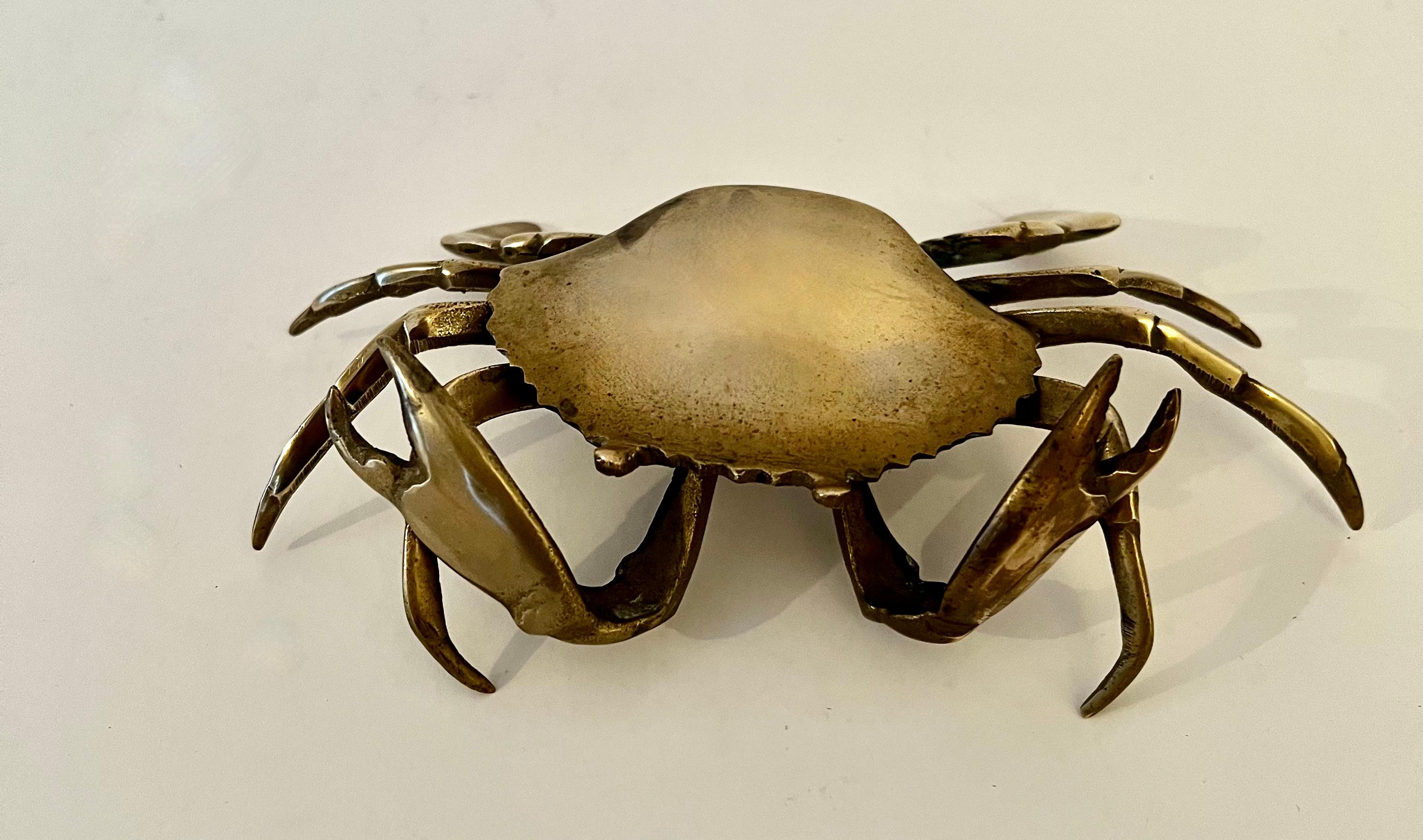 A small Cancer Crab that serves as a decorative item or for use as an ashtray or 420 tray. The brass is patinated but can be shined to a brilliant gold.

A compliment to many spaces and especially those by the water or Cancers! We have two this