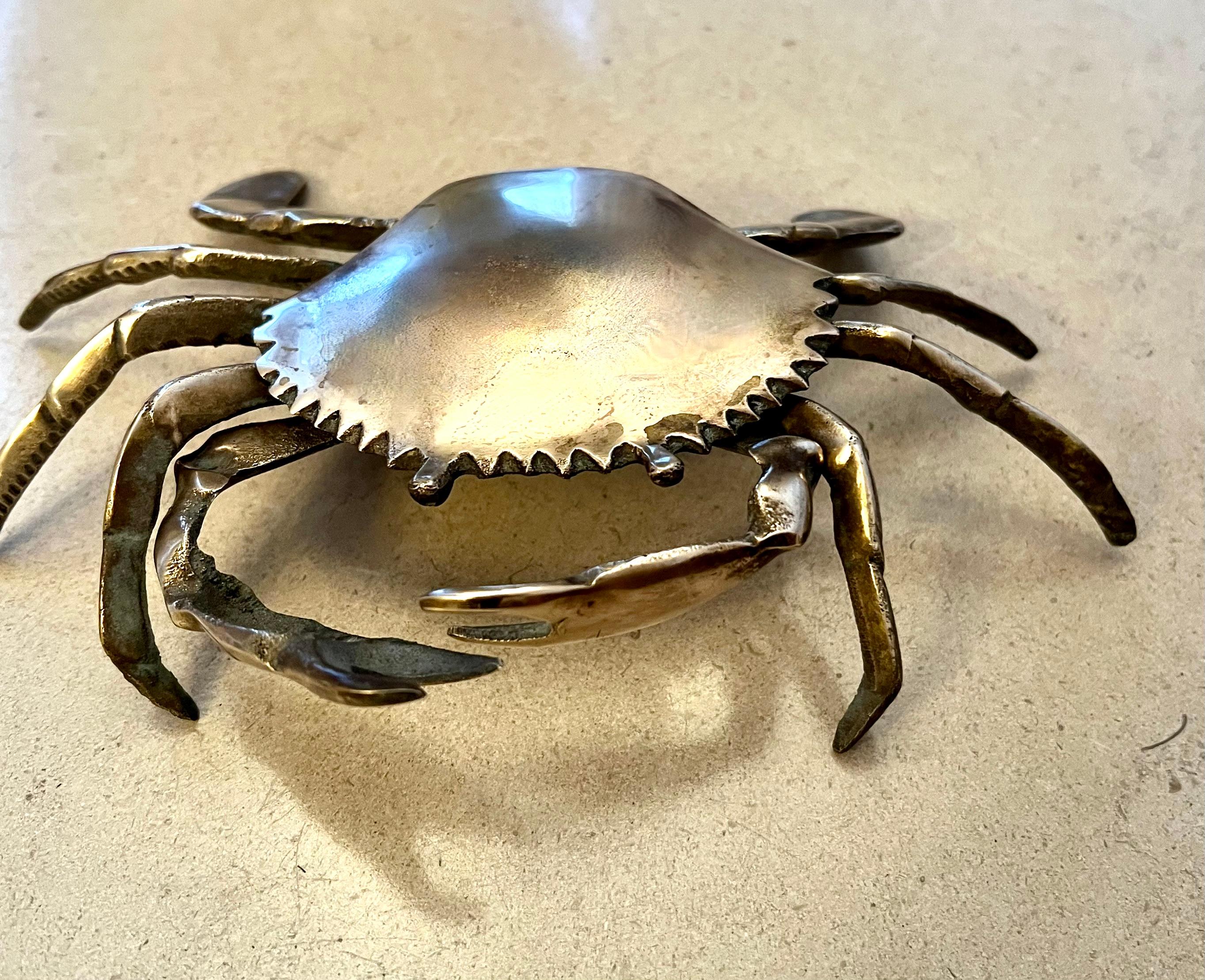 A small Cancer Crab that serves as a decorative item or for use as an ashtray or 420 tray. The brass is patinated but can be shined to a brilliant gold.

A compliment to many spaces and especially those by the water or Cancers! We have two this