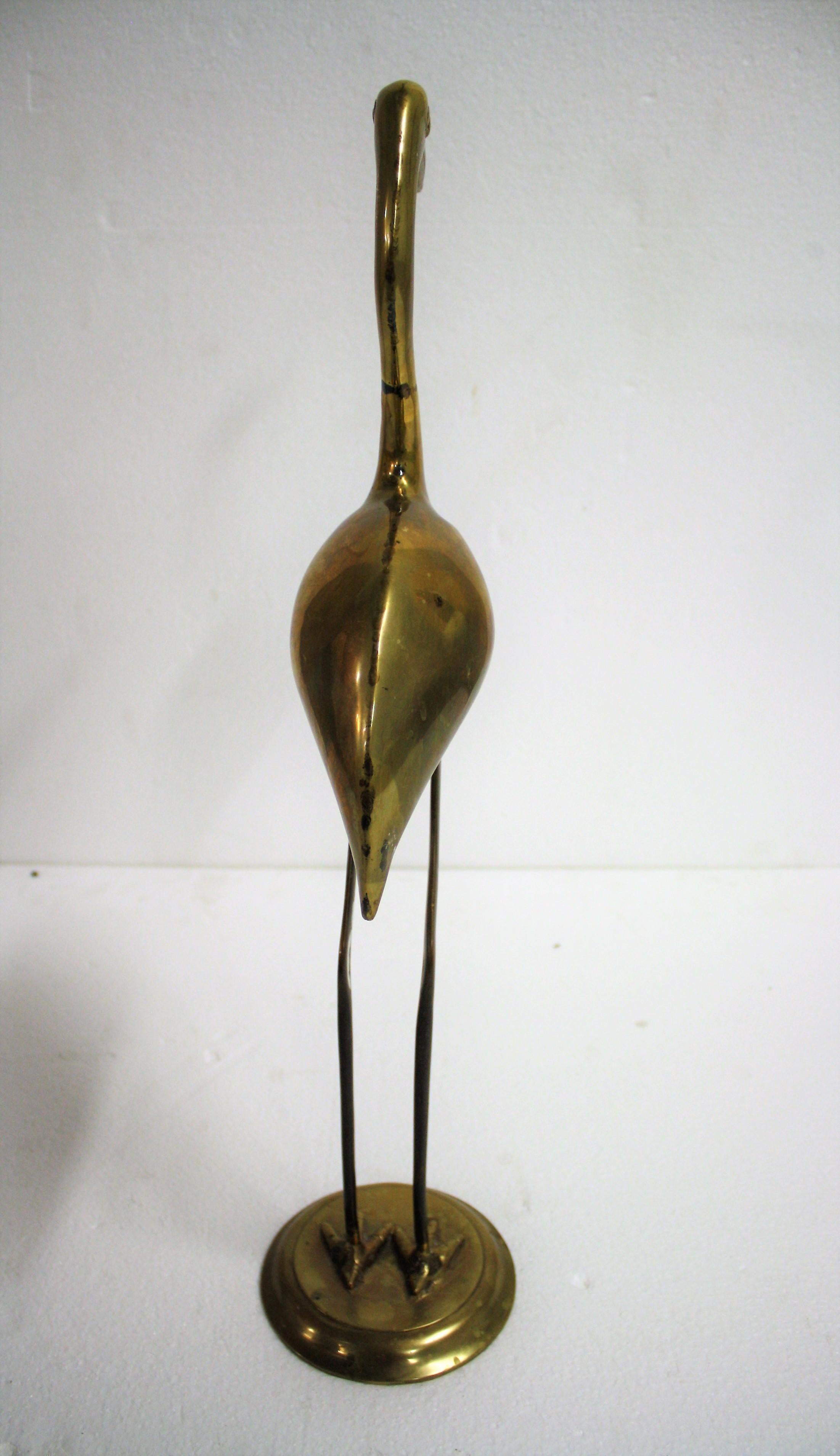 Midcentury brass crane bird sculpture.

Good original condition, slightly patinated which adds to the charm.

1970s, France

Good condition.

Dimensions:
Height 60cm/23.62