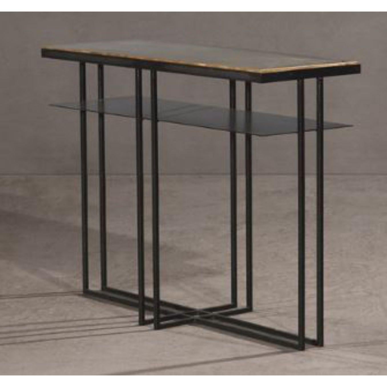 Brass cross binate side table by Novocastrian.
Dimensions: W 25 x D 71 x H 55 cm. 
Materials: A range of Cumbrian slates, blackened steel, hand patinated brass.
Also available in different dimensions. 


Novocastrian

We are metalworkers,
