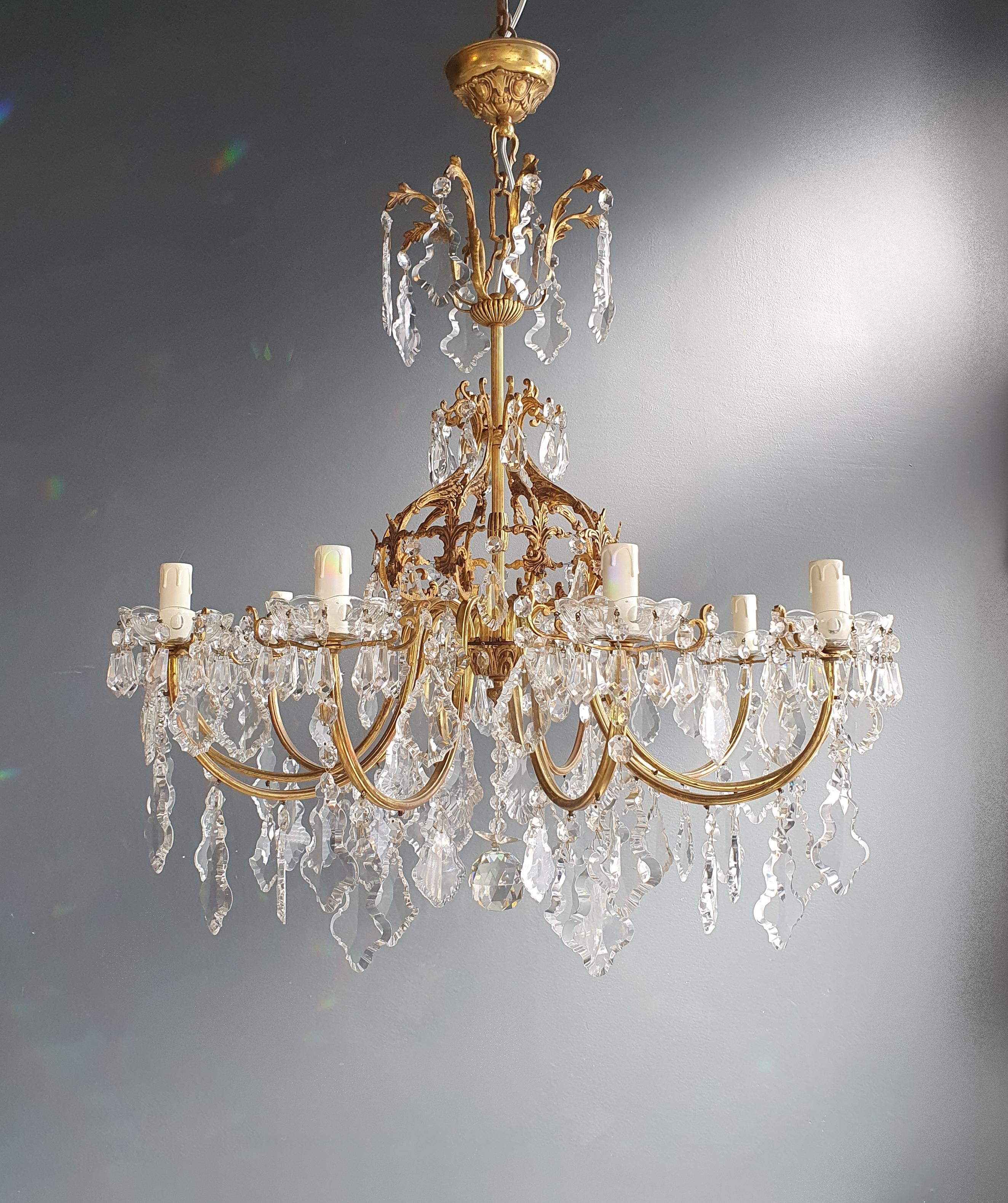 Beaded brass crystal chandelier antique ceiling lamp lustre Art Nouveau lamp

Measures: Total height 99 cm, height without chain 80 cm, diameter 80 cm. Weight (approximately) 15 kg.

Number of lights: 10-light bulb sockets: E14
Material: Brass,