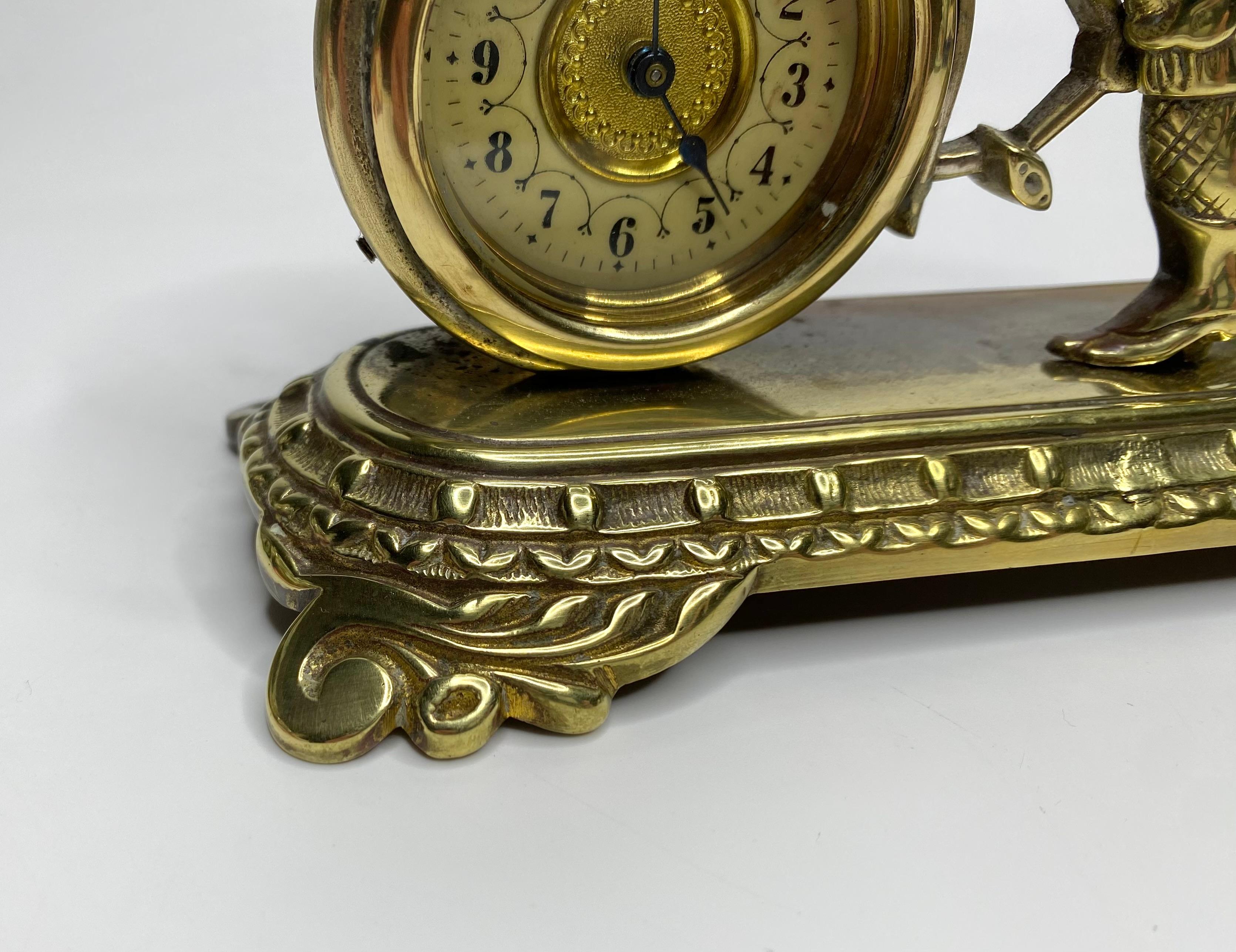 Brass cyclist and bicycle clock, England, c. 1910. 3