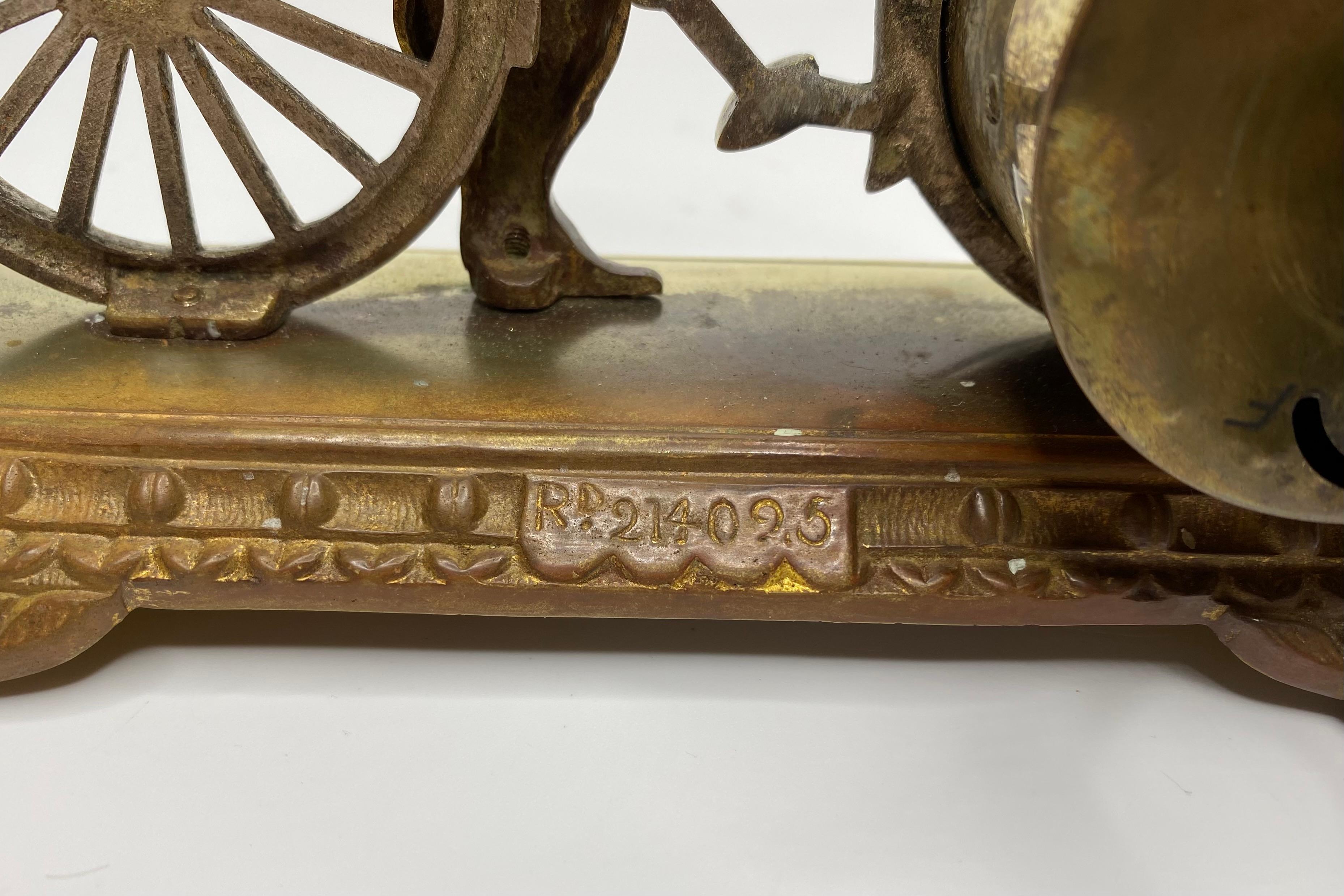 Early 20th Century Brass cyclist and bicycle clock, England, c. 1910.