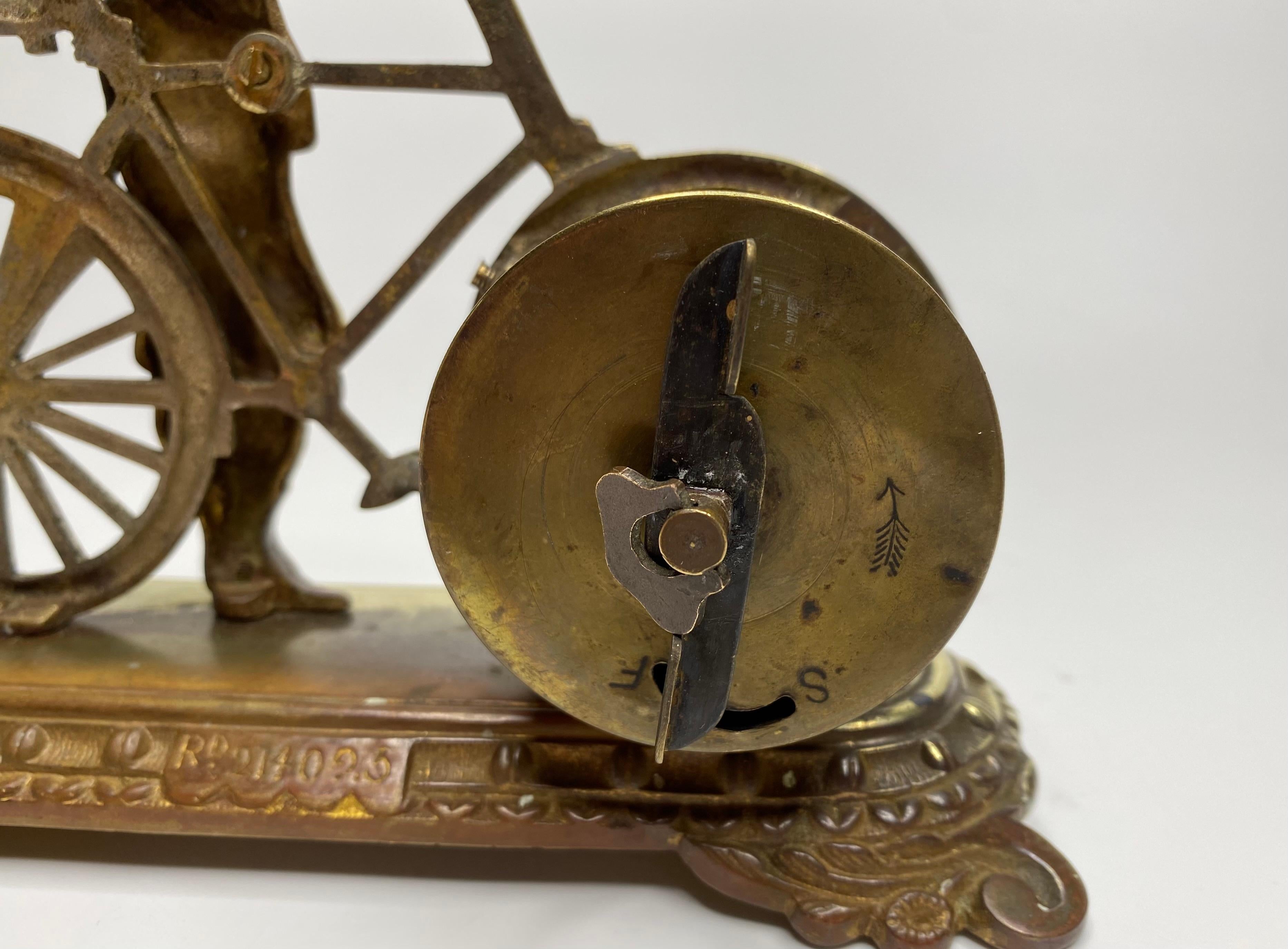 Brass cyclist and bicycle clock, England, c. 1910. 2