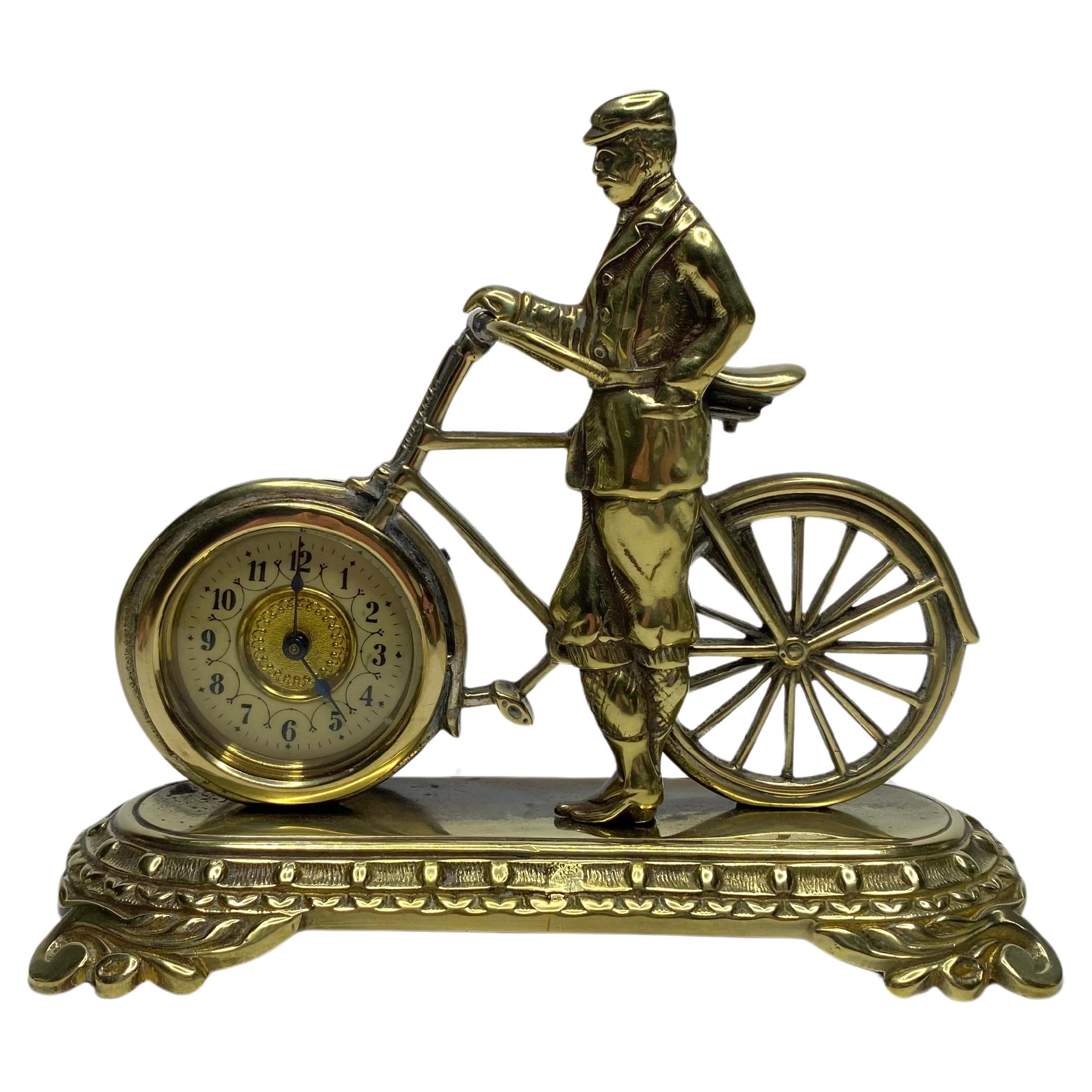 Brass cyclist and bicycle clock, England, c. 1910.