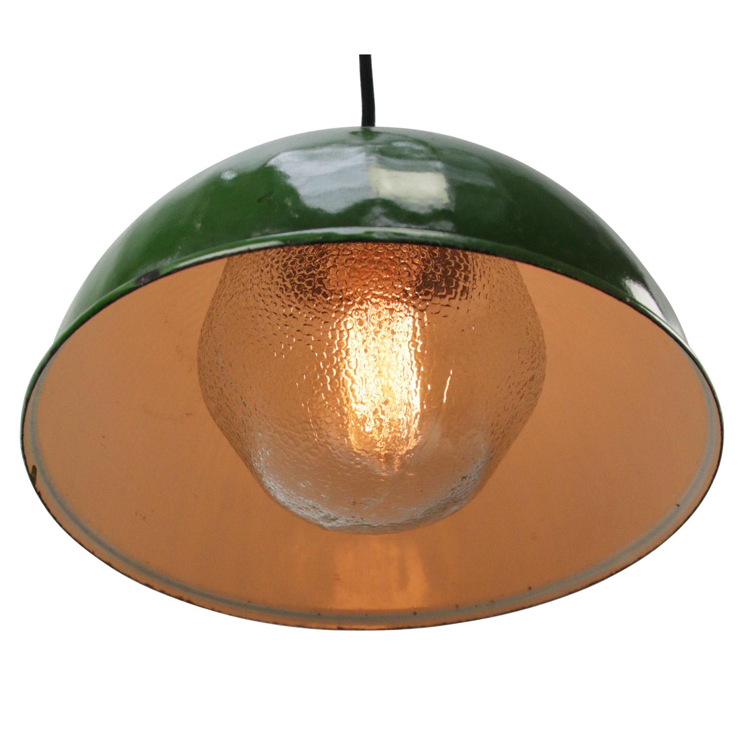 Dark green enamel Industrial hanging lamp.
Frosted glass with brass top.

Weight: 2.35 kg / 5.2 lb

Priced per individual item. All lamps have been made suitable by international standards for incandescent light bulbs, energy-efficient and LED