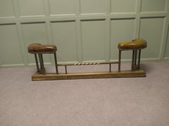 Brass Dark Green Leather Art Deco Club Fender This is a very luxurious piece