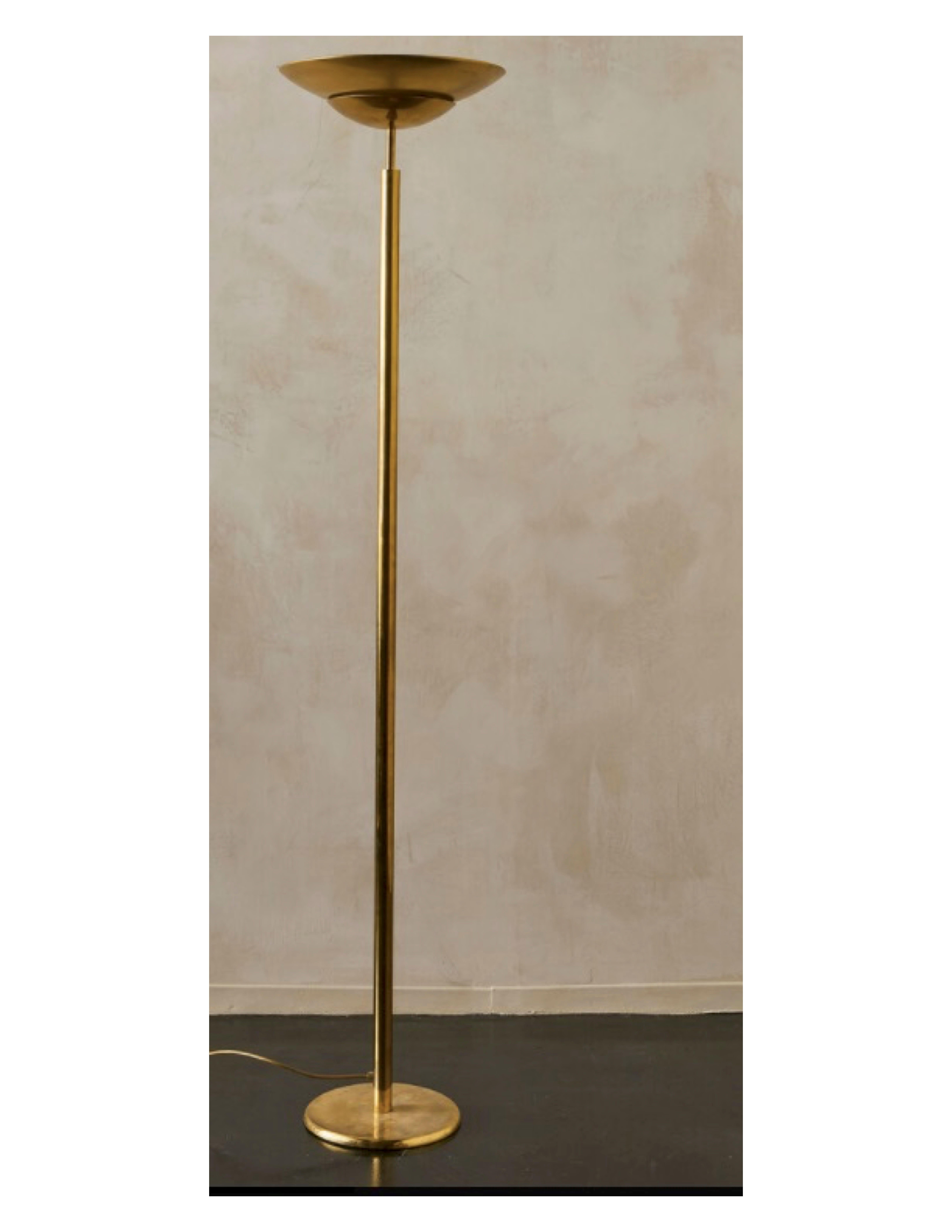 An Art Deco torchère style brass floor lamp sourced in Italy.