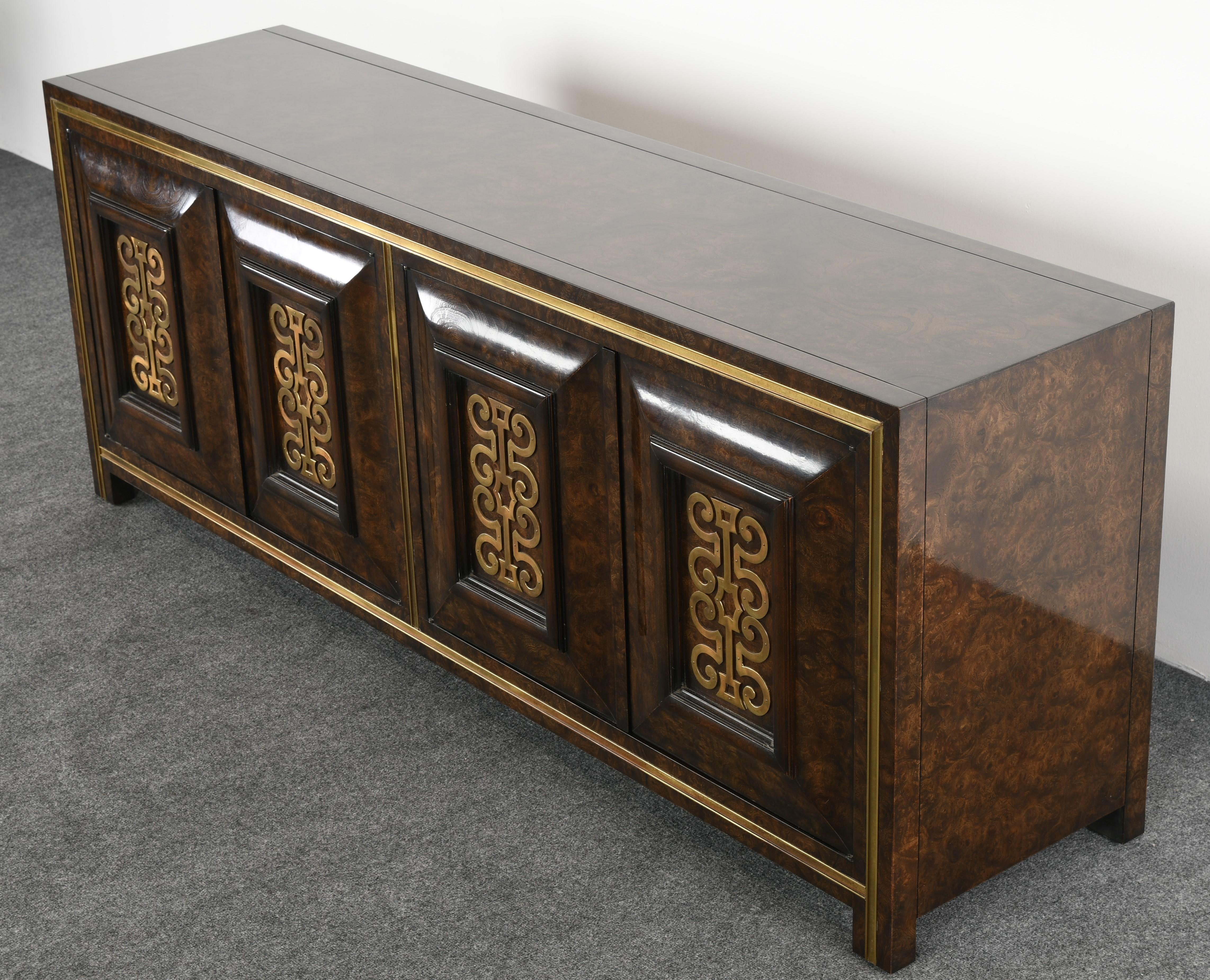 A stunning brass decorated Carpathian elm Mastercraft credenza or sideboard. Designed by William Doezema. Lovely detail of the brass design on the front of the cabinets. Would look great in an antique, modern or contemporary setting. Structurally