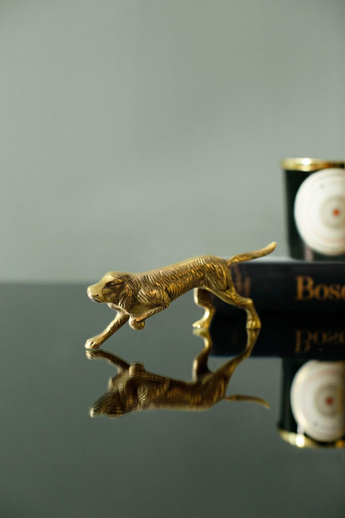 -Brass decorative object in a dog form.
-It would be a very nice, small collectable object for your interiors.

BRASS USE AND CARE
Clean surfaces with a dry cloth.
Minimize humidity and conditions that attract humidity.
Ensure surfaces are dry after