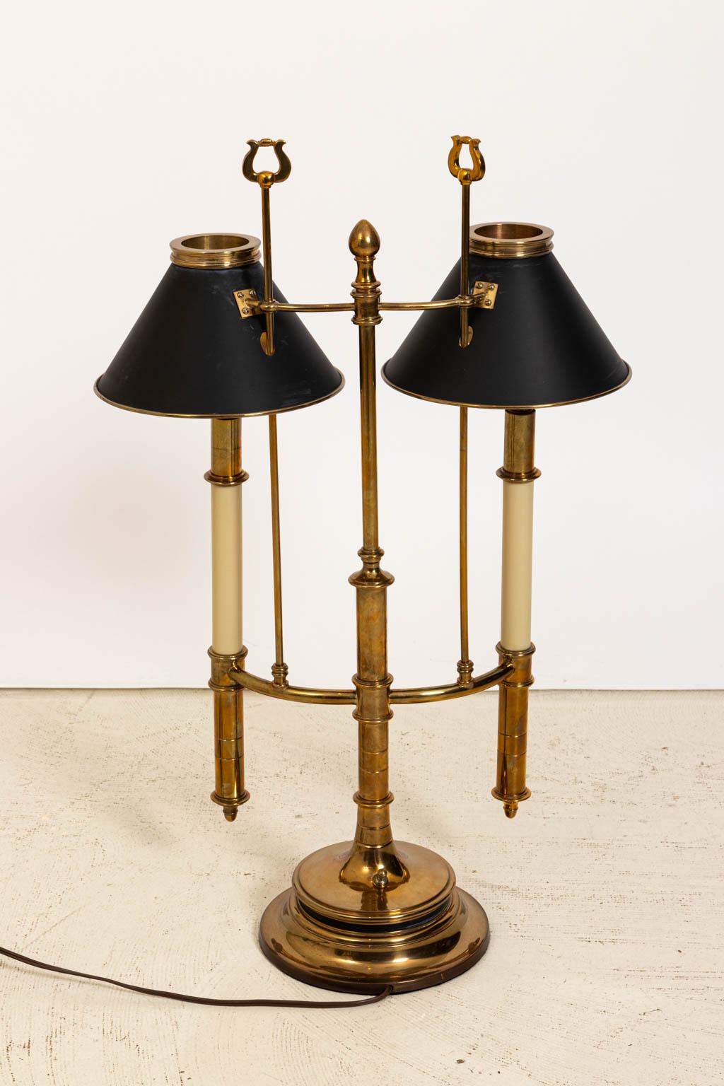 Edwardian style double light brass desk lamp with black tole shades circa 20th century. Shades not included. Made in the United States. Please note of wear consistent with age including minor oxidation and patina. The base of the lamp measures 8.00