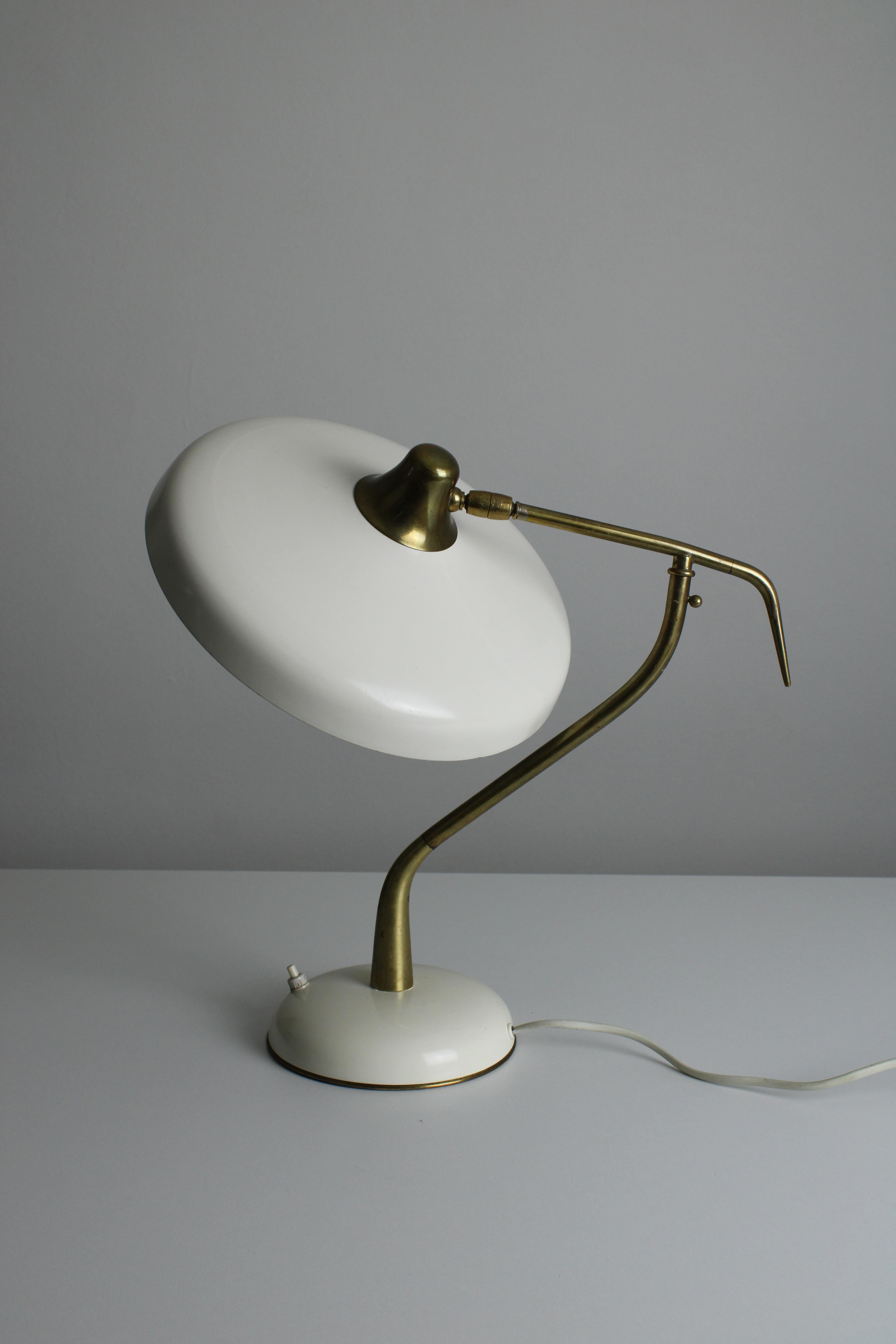 Sculptural desk lamp designed by Oscar Torlasco. Created by Milanese lighting company Lumi in the 1950s. This lamp features a classic Italian design, made with materials such as brass and aluminum. Not only fine design, but also very high quality.