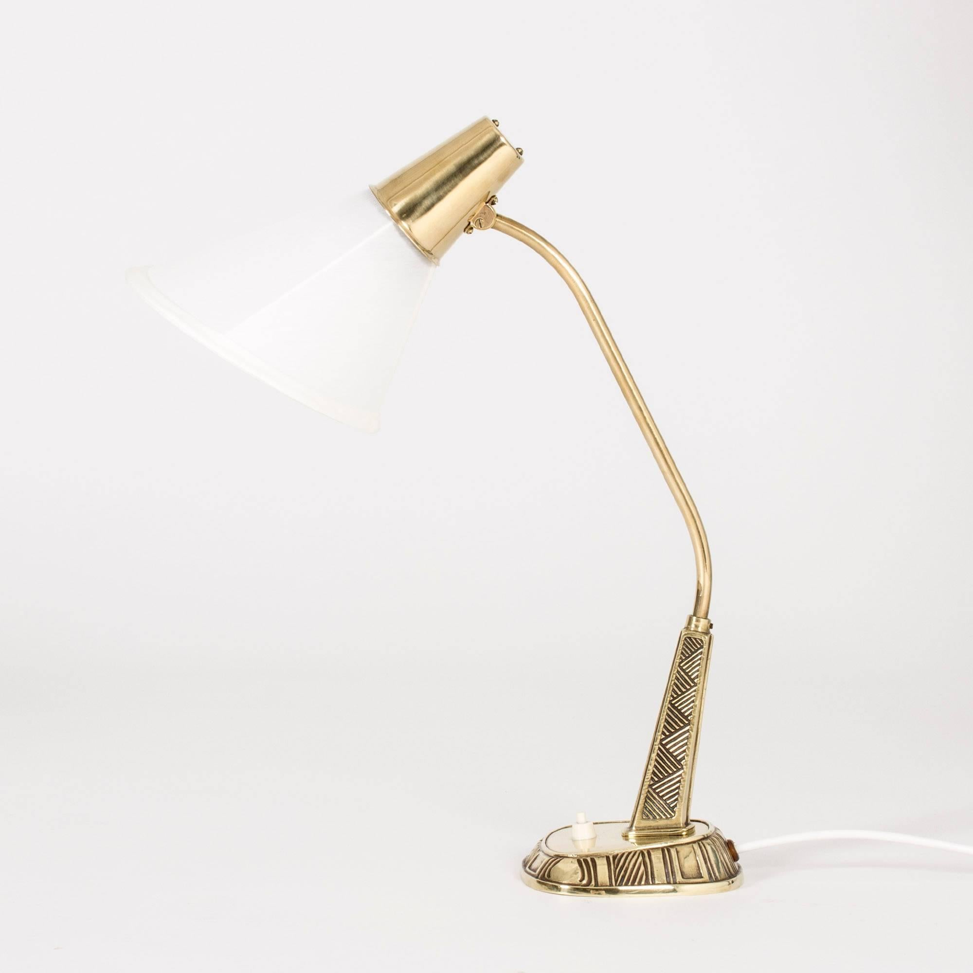 Edgy and elegant desk lamp by Sonja Katzin for ASEA. Brass body with an ethnic inspired pattern.